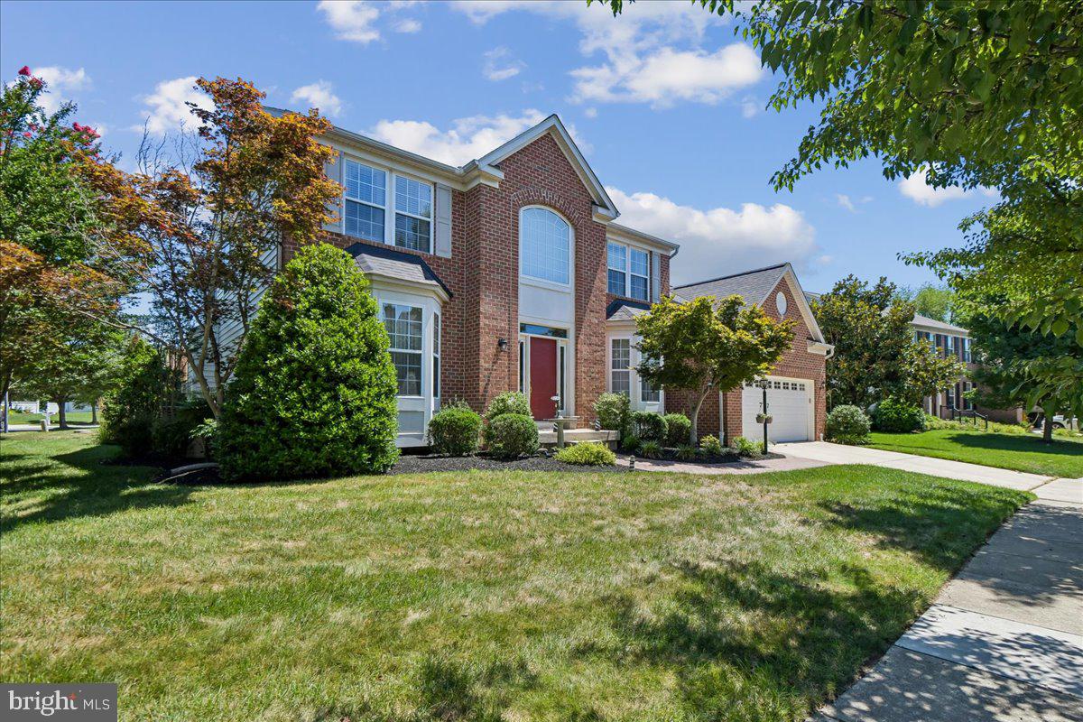 Welcome to a truly exceptional offering in St. Margarets Landing! Prime location meets turn-key design on a coveted corner lot, strategically hand-selected by the original owner for its sunlit openness, minimal pass-through traffic, and immediate gate access to neighborhood walking paths.
Inside, real hardwood flooring spans the main level, upper level hallway, and all staircases. Spanning 6 total bedrooms and 4.1 baths, the flexible layout is designed for modern multi-generational living with two Primary Suite options —including a main-level primary featuring soaring vaulted ceilings, and an upper-level primary suite alongside 3 additional spacious bedrooms. NOTE FOR SHOWINGS: Tax records incorrectly reflect the finished lower-level square footage; the basement actually features an expansive 900 sq. ft. in-law / multi-generational suite with an outside private entrance, designed for complete flexibility, along with two massive dedicated storage areas (see floor plans in photos).
The lovely main level flows seamlessly through a formal living room, great room with stone gas fireplace, breakfast area, large kitchen with plenty of counter space, formal dining area, laundry room, and garage entrance. Dual sliding glass doors off of the breakfast area lead to your outdoor retreat: a generous back deck and paver patio overlooking a fully vinyl-fenced backyard wrapped in mature, privacy-enhancing arborvitae trees and served by a 9-station irrigation system. Peace of mind is built right in, anchored by a roof replaced within the last five years and a full-home Generac backup generator that kicks on automatically in 30 seconds.
Located in the top-rated Broadneck School District, 605 Lighthouse Landing also affords rapid access to premier private education including St. John the Evangelist, Severn School, The Key School, Indian Creek, and the U.S. Naval Academy. An ideal commuter hub close to major employers like Fort Meade, NSA Headquarters, defense tech corridors (Lockheed Martin, Northrop Grumman, Booz Allen), Luminis Health Anne Arundel Medical Center, and downtown Annapolis.