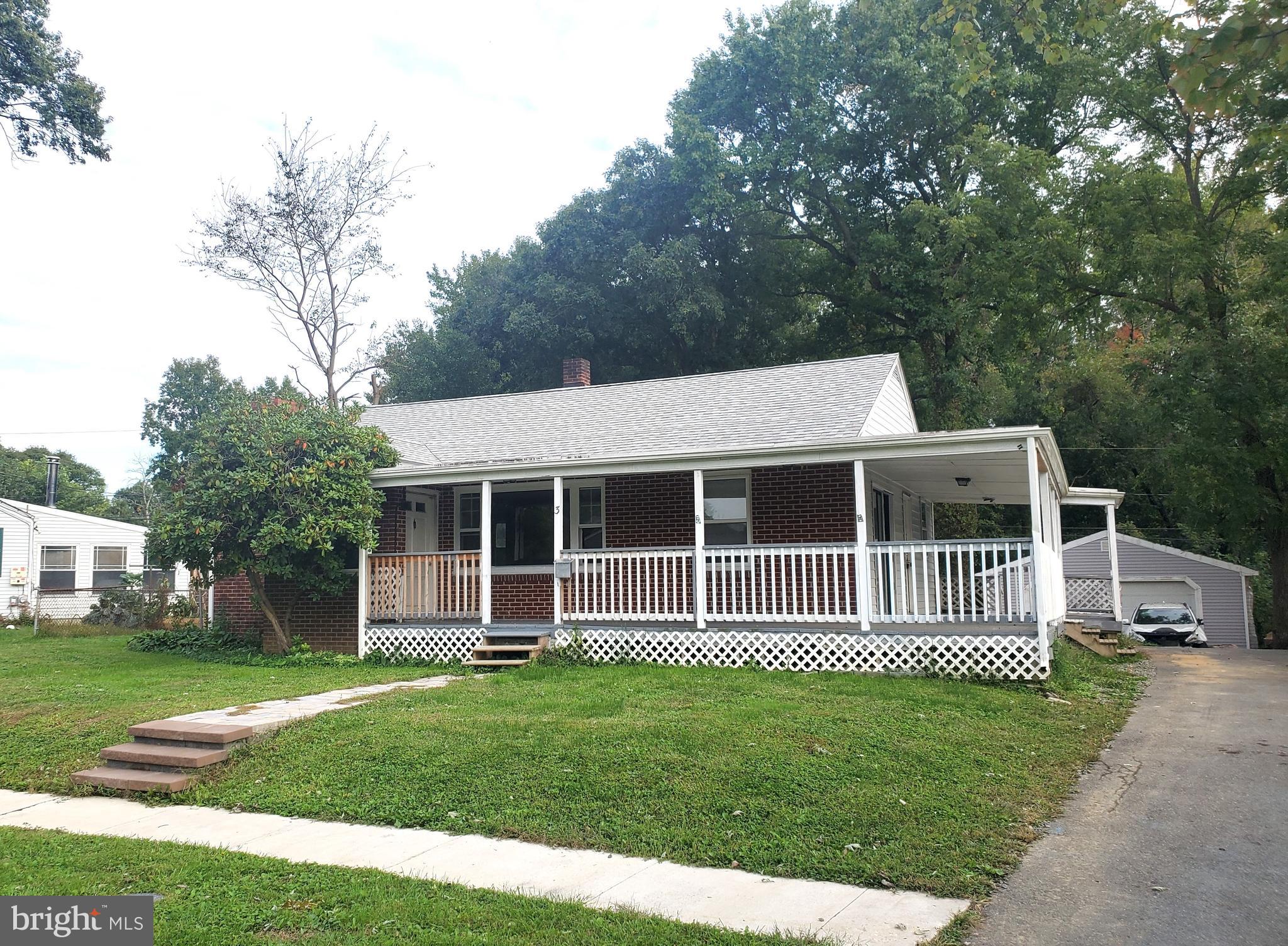 Great opportunity for a structurally sound ranch home with wrap around porch and detached garage.  Needs some work.  No government backed loans.
