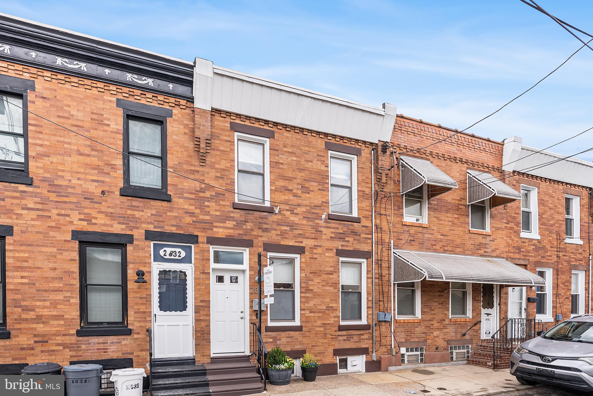 Have you been looking for a well-maintained home that’s full of charm? 2834 Miller St is a delightful 2 bed, 1.5 bath home in Port Richmond that has been loved and updated by its owners. A handsome facade welcomes you into an open living space. Exposed beams run throughout the living room, making it an extra cozy space to hangout in. With plenty of room for a couch, a dining nook, and even a work-from-home corner, this generous room can do it all! Stepping into the kitchen you’ll notice a fresh look with white cabinetry, stainless steel appliances and wood-detailed ceiling. Open upper cabinets allow you to show off your spices and glassware collection. Light streams in from a side window and through the glass door leading to the backyard. The yard has a privacy fence and room for a small garden, grill, and patio table. On the second floor you’ll find a full bathroom with a walk-in, tiled shower and modern fixtures. The home's beautifully preserved original hardwood floors really show off in the hallway leading into both bedrooms. The primary bedroom sits on the front of the home, and is bright and roomy - gaining extra space from a pocket door. The second bedroom has a closet and room for two desks - or would make a great nursery or yoga room. It also includes a space-saving pocket door. Back in the living room and behind the basement door is a toilet and sink - tucked away and convenient for guests to use. The unfinished basement is well-kept and has laundry, mechanicals, and room for storage. This pocket of Port Richmond has it all - grab a margarita at Nemi, sing your heart out at Tin Can Bar’s karaoke, and reserve your dough at Tacconelli’s.