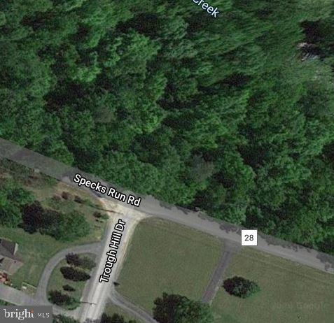 Unrestricted and No HOA!  674 ft frontage on state maintained road. This lush 3.81 acre lot is the perfect place for your dream home! Beautiful mature trees cover the property. Its close proximity to amenities and lengthy frontage on Mill Creek gives you the best of both worlds! 3 bedroom septic permit in hand. Add a well and you're ready to build. Or just bring your camper!