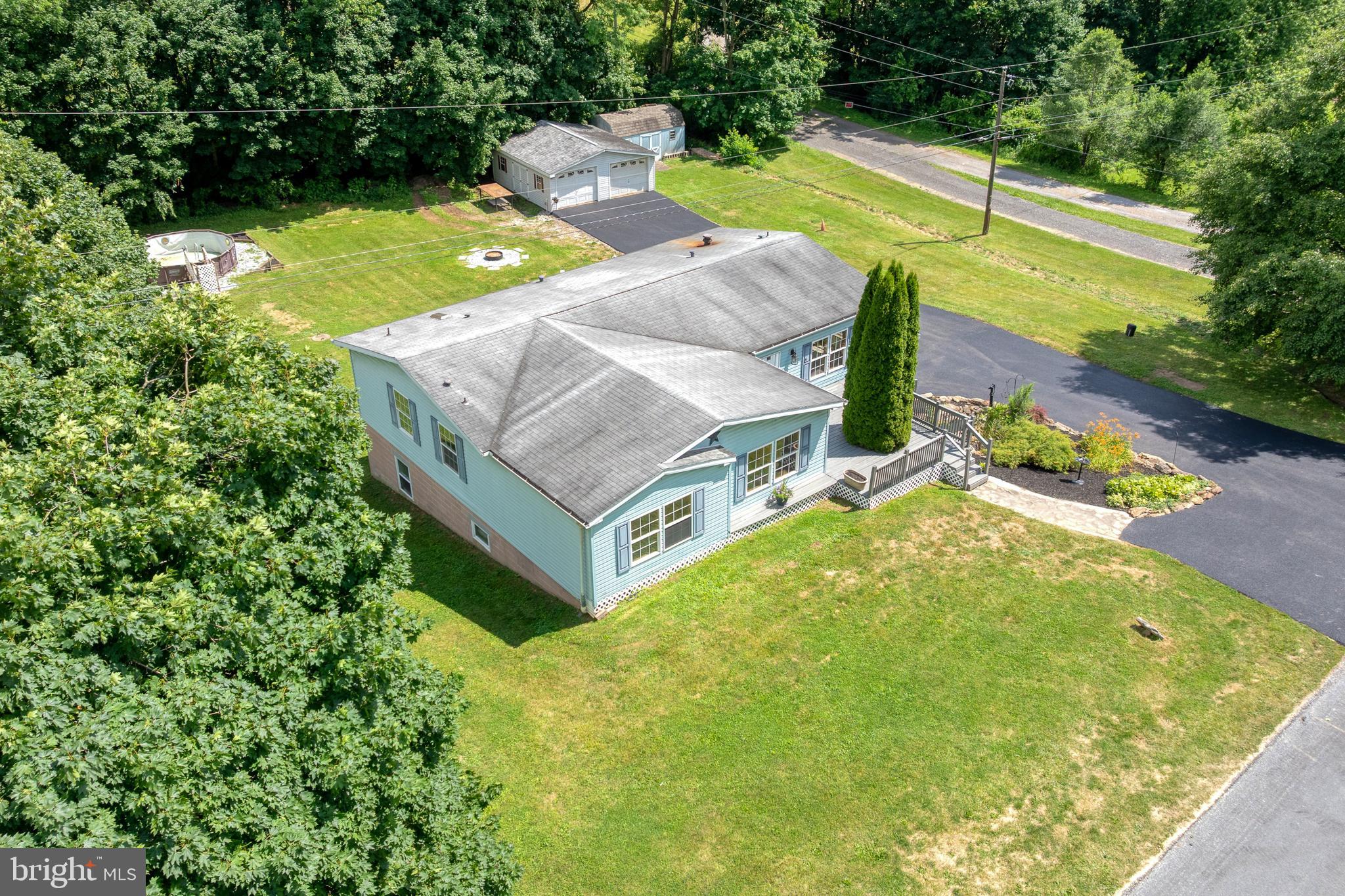 Welcome to 69 Gilbert Rd, a beautifully maintained and fully remodeled manufactured home situated on its own permanent foundation, offering the perfect blend of comfort, functionality, and peaceful country living. This spacious home features 3 bedrooms and 4 bathrooms, including 2 full baths and 2 half baths, providing plenty of room for family, guests, and everyday convenience. Bathroom includes a whirlpool tub! From the moment you arrive, you'll appreciate the pride of ownership throughout the property. The home has been meticulously cared for and thoughtfully updated, creating a move-in-ready opportunity for its next owner. Inside, you'll find comfortable living spaces filled with natural light, while the fully finished basement offers endless possibilities for additional living space, recreation, a home office, gym, or entertaining area. Outdoor enthusiasts and hobbyists alike will love the property's impressive amenities. In addition to the attached one-car garage, the property features a detached two-car garage with an additional workshop area equipped with 220-amp electrical service, making it ideal for mechanics, woodworkers, craftsmen, or anyone needing extra workspace. An additional storage shed provides even more room for tools, equipment, and seasonal items. Step outside and enjoy your own private retreat. A beautiful wraparound-style deck and porch surround the home, offering multiple spaces to relax, entertain, or simply enjoy the scenic surroundings. Cool off during the summer months in the above-ground pool. Property has a beautiful landscape with little stone pond! For added peace of mind, the well and septic system were recently tested and the septic system was pumped in April 2026. Conveniently located just off Delta Road, this property offers easy access to shopping, dining, schools, parks, and other nearby amenities while still providing the privacy and serenity of a country setting. Whether you're looking for extra garage space, a workshop, outdoor recreation, or simply a well-maintained home with room to spread out, 69 Gilbert Rd offers a unique opportunity that combines comfort, convenience, and exceptional value. Schedule your private showing today and experience everything this remarkable property has to offer.