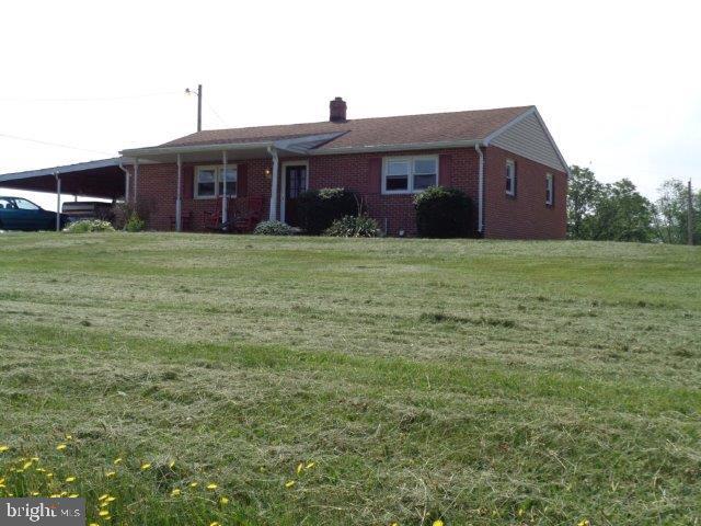 Quaint brick & vinyl-sided ranch home on 1+ acres and a 24' x 16' Morton storage building. Attached 2+ carport. Wood floors throughout home. Central-air, UV-Lite on well system and eat-in kitchen. A must see for the first time home buyer. Real estate taxes are approximated at this time.