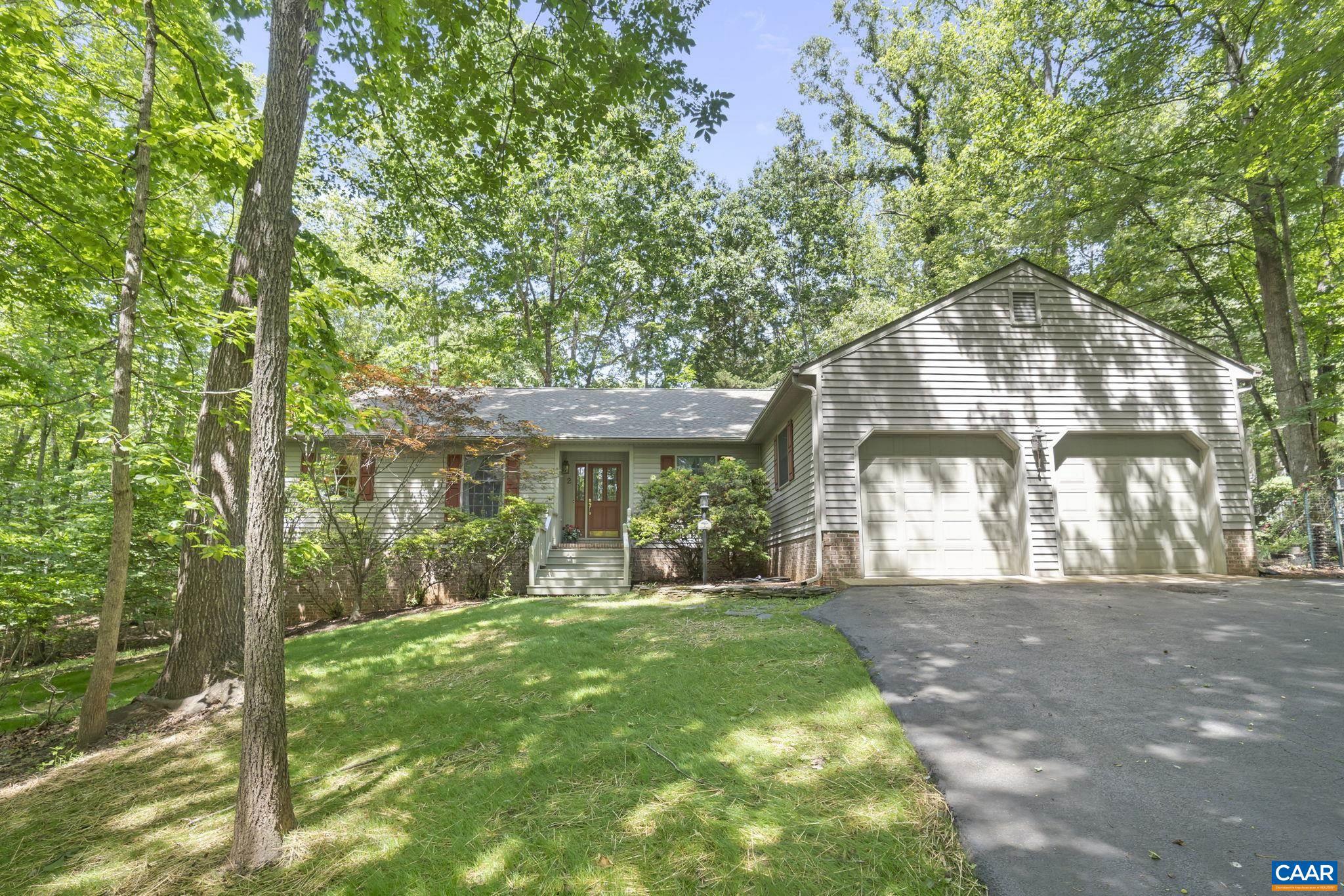 COME INSIDE! You'll be impressed when you see this Spacious & Immaculate Custom Built Home. LOCATION! LOCATION!  Tucked Away at the end of a cul de sac next to the Reserve Area & A Private Path to the Beach. Enter into your large foyer & hardwood floors throughout 1st level. There is a Formal Dining Rm, Living Rm, Family Rm w/Wood burning Fireplace, built in bookcases.  Large chef's kitchen w/garden window, double oven/microwave, plenty of counter space & cabinets, Jennaire cook top, breakfast bar, pantry, breakfast rm.  View the private outdoors through your oversized windows & doors. Wide hallways, wide solid wood doors throughout. Huge primary bedroom w/attached bath, whirlpool tub & shower + 2 closets. Take in the quiet & nature while sitting on your Amazing 24' x 12' Side Screen Porch. Attached 2 car garage on grade w/floored attic storage. Large Laundry/Mud room off garage w/sink & cabinets.  Lower level features a 4th bedroom, home office/bonus rm w/a large utility rm for added storage. Discover why this home & Lake Monticello is like vacationing at home Year Round. New water piping 2025, New Roof 2021, Hot water heater 2024, HVAC/AC 2022, Furnace 2019, Sealed crawl space, 2025. Paved driveway, patio & seasonal water views.,Formica Counter,Wood Cabinets,Fireplace in Family Room
