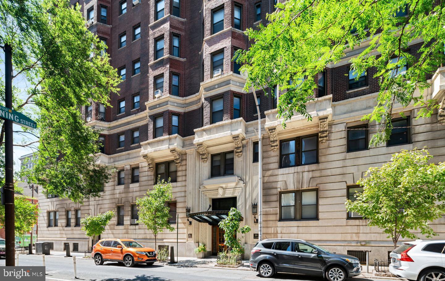 This is a Northwest corner unit at the Lenox Condominiums with large scale rooms, high ceilings and 11 windows that offer great light and skyline views. It has been well maintained and has recent upgrades including new flooring, new paint job, kitchen countertops and bathroom vanity. The kitchen has a door to the fire escape and it provides great air flow. The spacious living room can be used as a combination living and dining room. The equally large eat-in kitchen has an abundance of storage space with plenty of cabinets and a pantry closet. The bedroom is 16’ x 19’ and has a bay window at one end and a ceiling fan. The extra space in the bedroom can be used as a home office or an extra seating area. The bedroom has closet space and there are two large walk-in closets in the hallwa, one could be used as a home office. The bathroom has been upgraded and includes a linen closet. The association now allows individual owners to install mini-split air conditioning and washer/dryers with prior approval, and many owners have installed them. The Lenox Condominium was designed by famed New York architects Clinton and Russell. It was built in 1920 and renovated into condominiums in 2004-5. The units have large scale rooms, high ceilings, lots of windows and many units have their original architectural elements. It is a Doorman building and is centrally located at the southern end of Mid-town Village in the Washington Square West Neighborhood. It is 2 blocks from the great shops, restaurants, theatres and nightlife of Midtown Village, Walnut Street, and the Avenue of the Arts. It is also just a few blocks from Thomas Jefferson and Pennsylvania Hospitals. There are many public transportation options within a few blocks of the Lenox. The condo fees include a 24/7 door staff, heat, hot water, and high-speed internet. The owners pay their own electric and Cable TV, and the building offers additional storage for a small fee. There are many parking, gym, and day care options within 2-3 blocks. It is a pet friendly building and the tree lined historic neighborhood is a beautiful place to walk dogs.