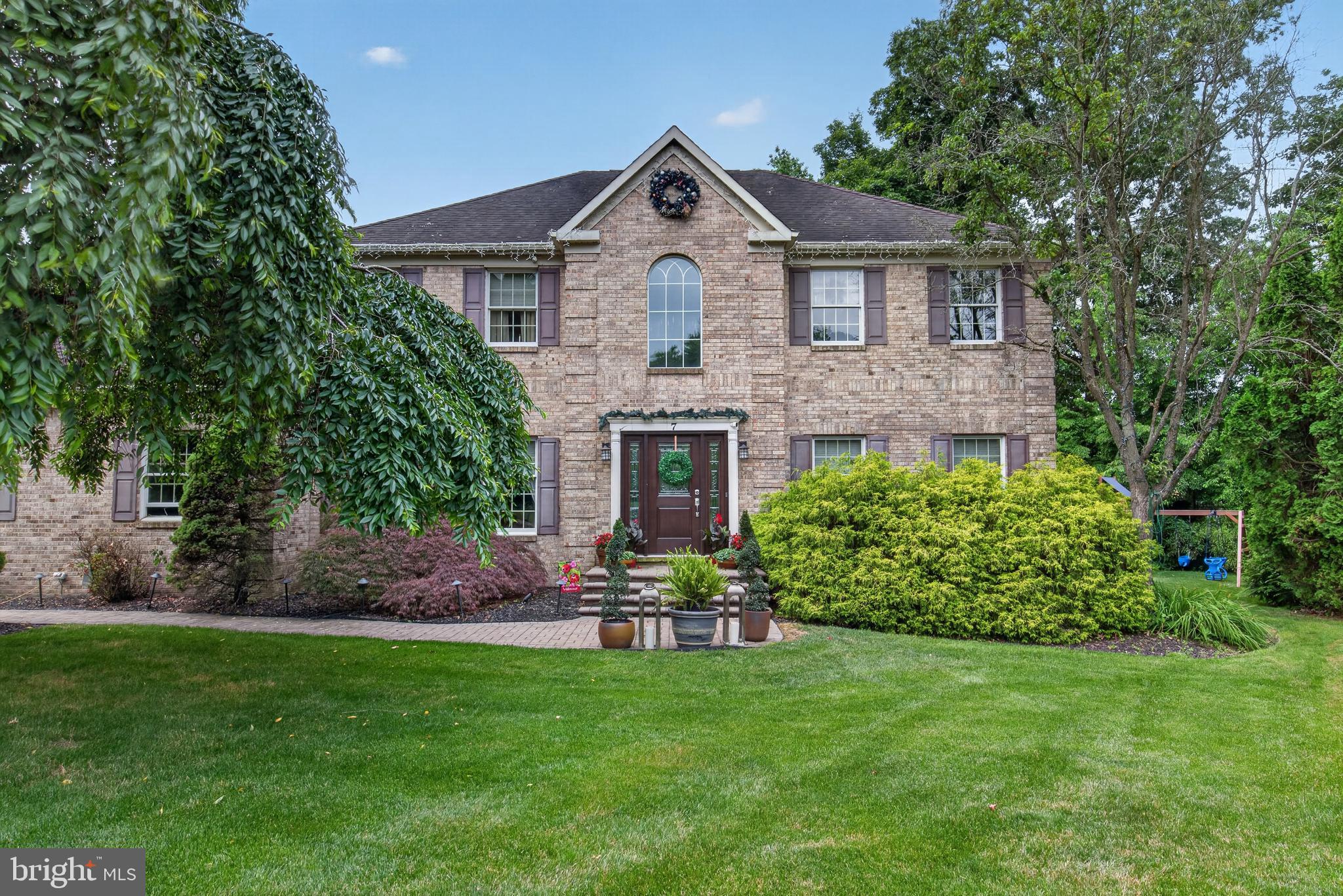 Situated at the end of a quiet five-home cul-de-sac in sought-after North Wilmington, this elegant Capano-built colonial totaling 5,355 Sqft of livable area is offered. The immaculate design boasts timeless architecture, thoughtful updates, and exceptional warm living space.A dramatic two-story foyer welcomes you into the home, flanked by a formal living room with crown molding and a gracious dining room featuring crown molding and chair rail detailing—perfect for both everyday living and entertaining.The beautifully updated eat-in kitchen (2019) serves as the heart of the home, showcasing Italian tile flooring, granite countertops, a striking granite waterfall island, tile backsplash, recessed lighting, pantry storage, and stainless-steel appliances. Adjacent to the kitchen is the convenient main-level laundry room with access to the rear deck and attached garage.Just beyond, the inviting family room features soaring cathedral ceilings, skylights, new carpeting, and a dramatic floor-to-ceiling brick fireplace, creating a warm and comfortable gathering space. A private office and powder room complete the main level.Upstairs, the spacious primary suite offers a relaxing retreat with a private bath featuring a Jacuzzi tub, separate shower, double vanity, and tile flooring. Connected to the suite is an impressive exercise room with hardwood floors, mirrors, and skylights—easily adaptable as a sitting room, studio, or additional flex space. Three generously sized bedrooms and a hall bath complete the upper level.The finished basement provides outstanding additional living space designed for entertaining, highlighted by a wet bar, expansive recreation area, beautiful wainscoting, and a powder room with marble flooring. An additional tiled room offers versatility for hobbies, fitness, or storage. Completed around 2015, the lower level also includes a separate HVAC system for added comfort.This exceptional home blends the craftsmanship of a respected Capano builder with modern updates, generous living areas, and a prime North Wilmington location—an outstanding opportunity to enjoy refined suburban living.