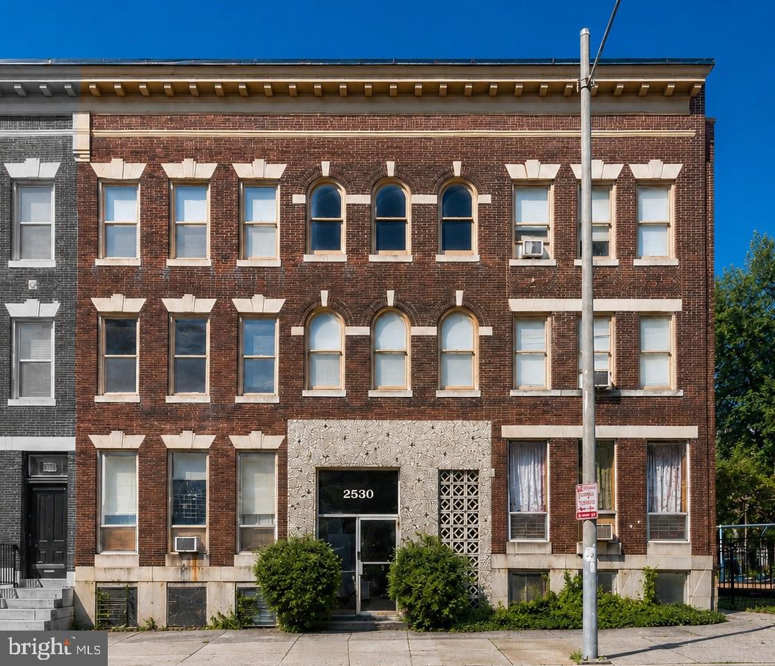 2530 North Calvert Street presents a rare mixed-use investment opportunity in the heart of Charles Village. Situated on three consolidated lots with 52 feet of frontage along North Calvert Street, the property is currently configured with 10 residential apartments and four office suites, providing multiple income and occupancy strategies.

Held under long-term ownership with limited capital improvements, the property offers significant value-add potential through apartment renovations, capital improvements, lease-up, and future redevelopment. OR-2 zoning allows both residential and office use and, by right, permits up to 32 apartments on the site, offering long-term redevelopment potential beyond the existing 14-suite configuration.

Located 5½ blocks from Johns Hopkins University's Homewood Campus, the property benefits from one of Baltimore's strongest rental corridors. The site also enjoys an attractive northern boundary adjoining the Margaret Brent Elementary School playground, creating an uncommon sense of openness along North Calvert Street.

Whether the next owner pursues light cosmetic improvements, substantial capital renovations, or a higher-density redevelopment strategy, 2530 North Calvert Street offers multiple value-creation paths in one of Baltimore City's most established investment neighborhoods.