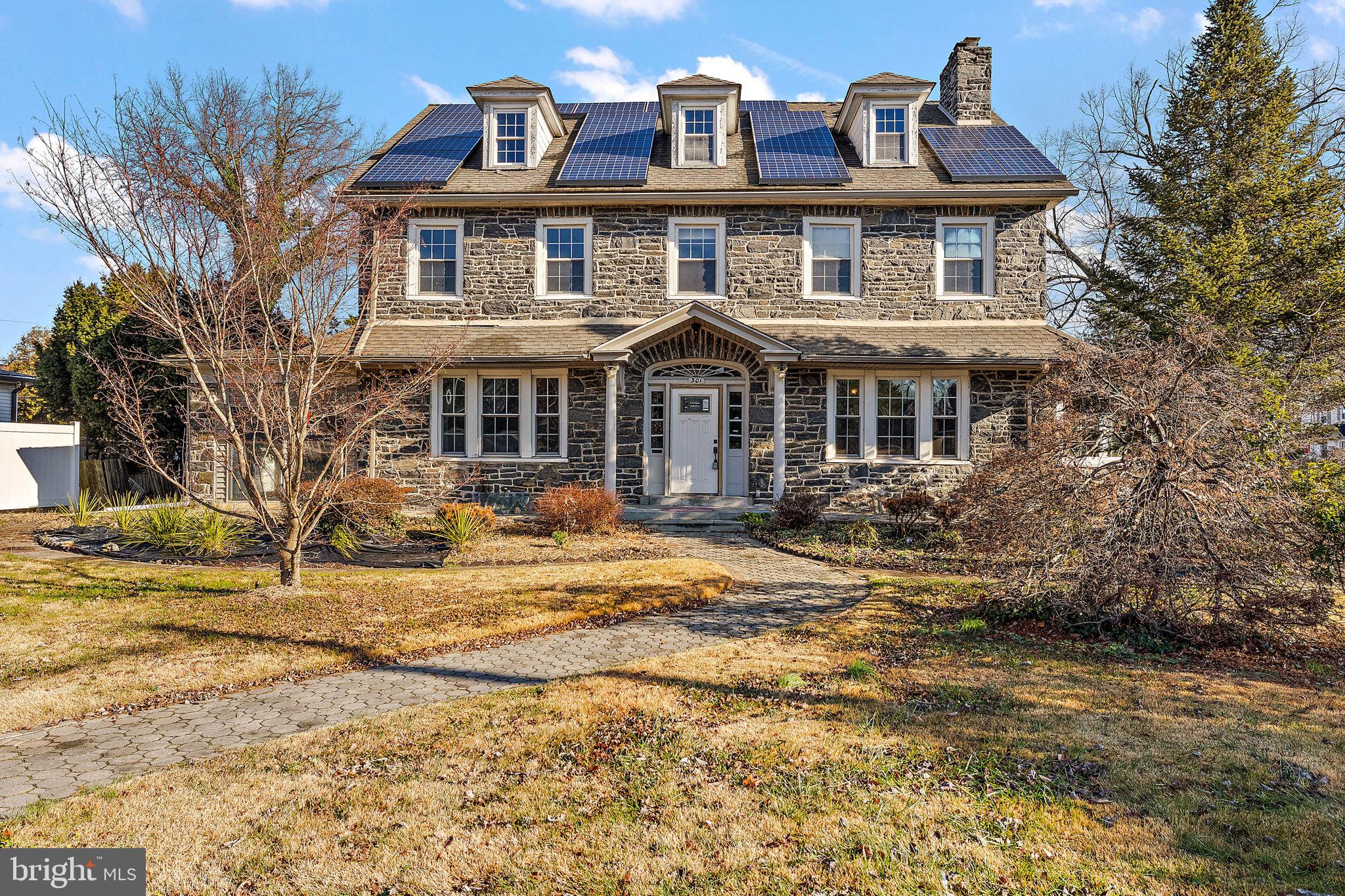 Explore this unique opportunity in Lansdowne, PA! With 5 bedrooms, an updated kitchen, 3 full baths, and 2 half baths, it caters to contemporary living needs. Hardwood floors adorn the spacious living and dining areas, complemented by inviting sunrooms on the main floor. Architectural details accentuate the home's charm, and dual staircases add accessibility and character. Zoning allows for both residential and professional use, but note that the property requires significant renovation work before occupancy. Features include solar panels, a fully finished basement with an extra kitchen, ample storage, and a two-car garage. The expansive yard offers space for outdoor activities and relaxation. Seize the potential of this property with a vision for renovation and customization. Schedule a private viewing to uncover its possibilities. Please note: Knob and tube wiring have been removed and updated by a licensed master electrician.