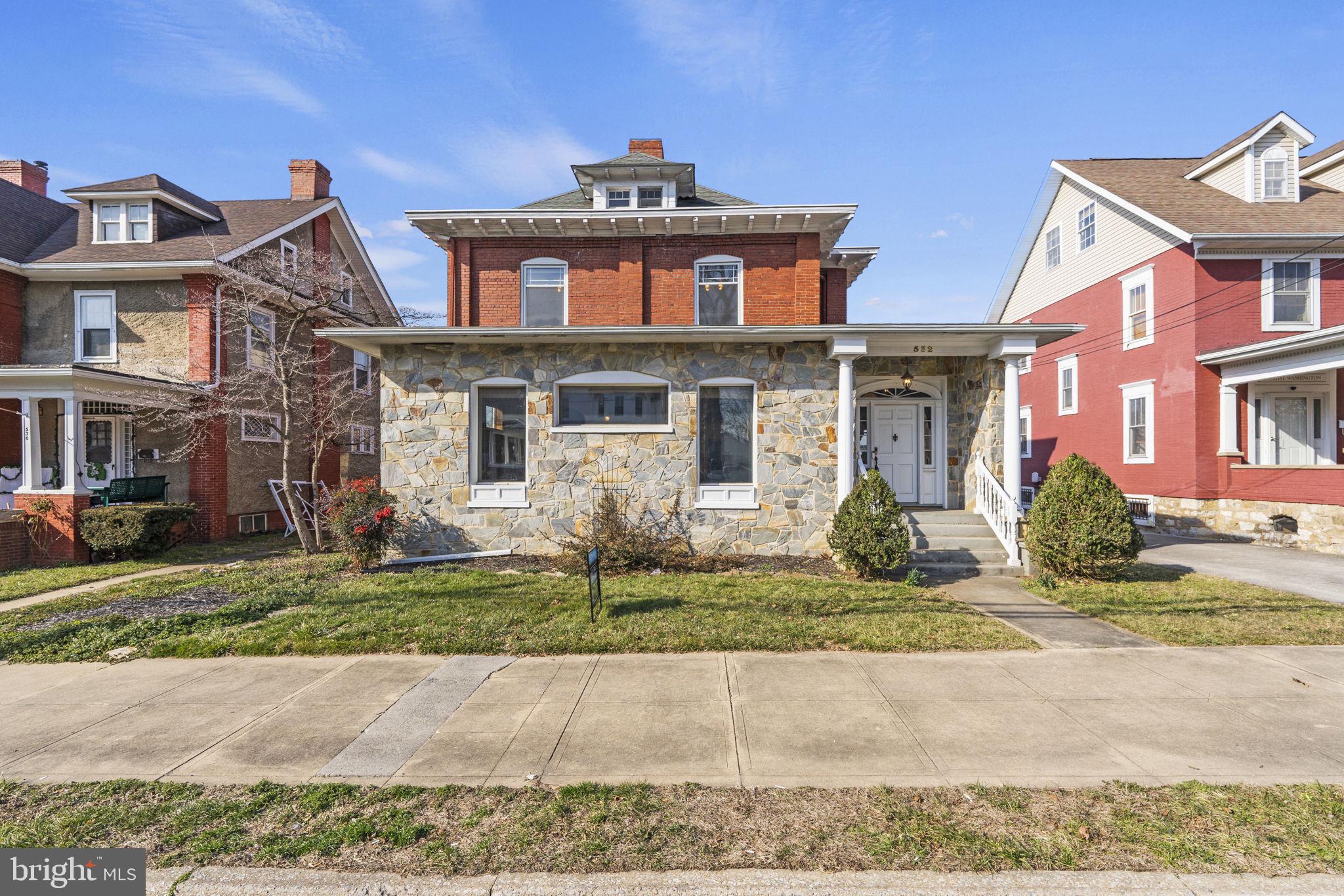 🏡 Welcome to 532 East Washington Street, Charles Town, West Virginia—an enchanting blend of historic charm and modern comfort awaits you in this impressive “Foursquare” type home.
Built in 1914 and proudly listed in the National Registry of Historic Places, this residence is a testament to timeless craftsmanship and enduring elegance. As you step inside, you'll be greeted by the inviting warmth of original coffered ceilings, crown molding, hardwood floors, and exquisite millwork—a true homage to the early 20th-century architectural style. 
With 9-foot ceilings and over 3700 sq ft this home offers ample room to grow and thrive. The updated kitchen and bathrooms provide a perfect balance of functionality and sophistication, while the fully renovated bath boasts a luxurious steam shower for a touch of indulgence.
Don’t miss the 600 sq ft (approx.) of finished attic space that is ready to be a cozy reading nook, charming office space, playful play area, or creative hobby haven. So many options
2 fireplaces with original oak mantels. The fireplaces are perfect candidates for gas log installation.  They share 1 flue as was the standard of the time.
Additional features include a water softener with de-chlorination.  Refrigerator, microwave, dishwasher, washer/dryer all 2021. The HVAC is believed to be less than 6 years old, ensuring convenience and peace of mind for the lucky new owners.
Outside, the 700 sq ft (approx.) wrap-around porch offers a tranquil retreat where you can relax and unwind amidst the beauty of the private garden backyard. In-law suite above the detached 1 car garage with endless potential for extra space or rental income. The in-law suite has a bedroom, full bath, kitchenette, washer/dryer hook up and a separate entrance.
Located within short distance of downtown amenities, parks, and restaurants, this home offers the perfect blend of historic charm and modern convenience. Don't miss your chance to own a piece of Charles Town's rich history—schedule a showing today and experience the timeless beauty of 532 East Washington Street!