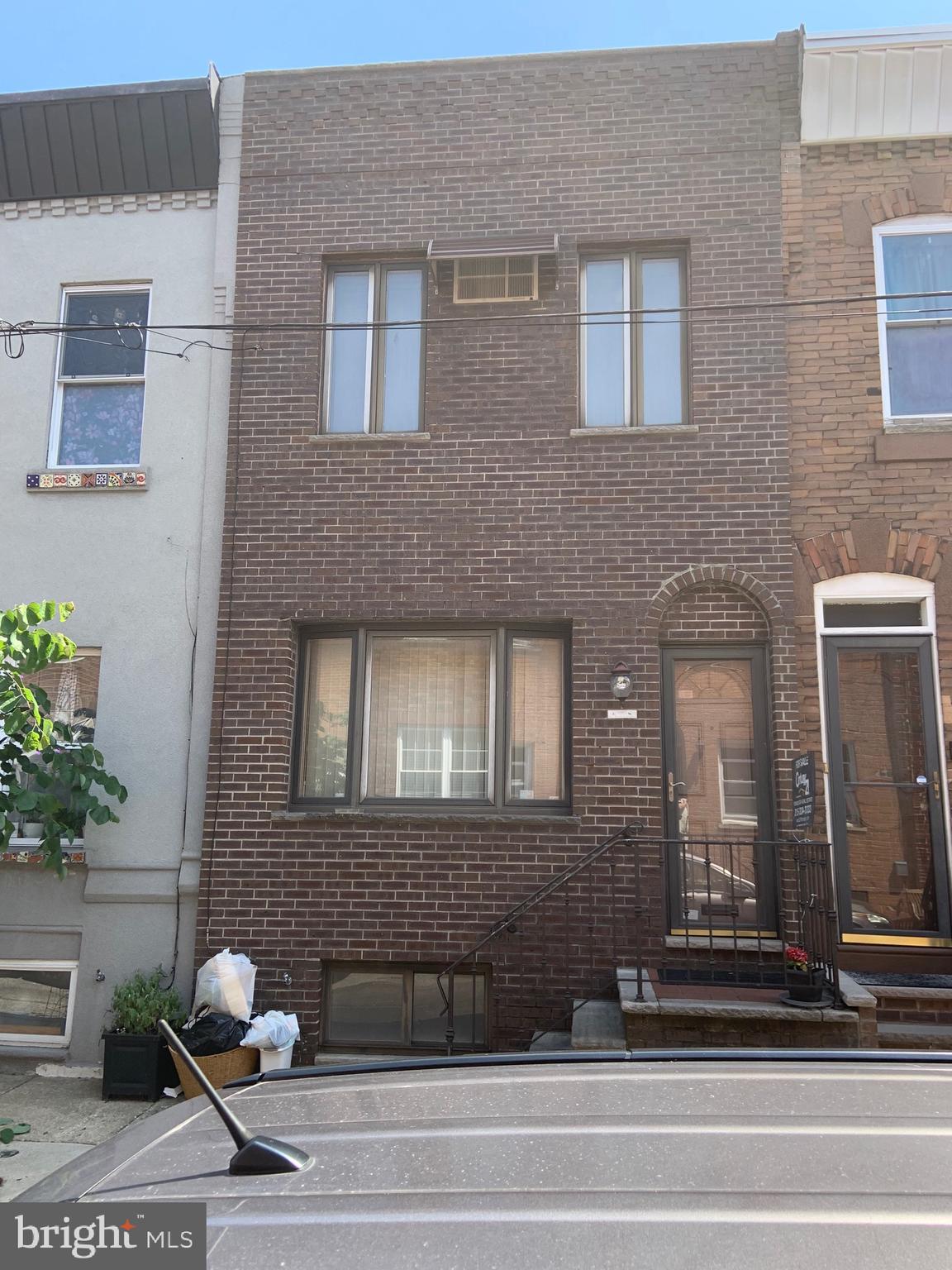 Well-maintained 2-Sty Rowhome in the heart of South Philly! Basement - full and unfinished with all sound  mechanicals and washer/dryer; First Floor - Entry Foyer, large living room with high ceilings,  dining area, Modern eat-in Kitchen with Upper and Lower wood cabinets, formica CTS,  refrigerator, DW, GD, microwave, gas range, and door to rear yard; 2nd Floor - Two (2) nice-sized  bedrooms with pkenty of closet space, Modern 3-piece caramic tile bath. Newer  Brick Front Facade! Being sold in its  "AS-IS" condition! Gas is off in the property!