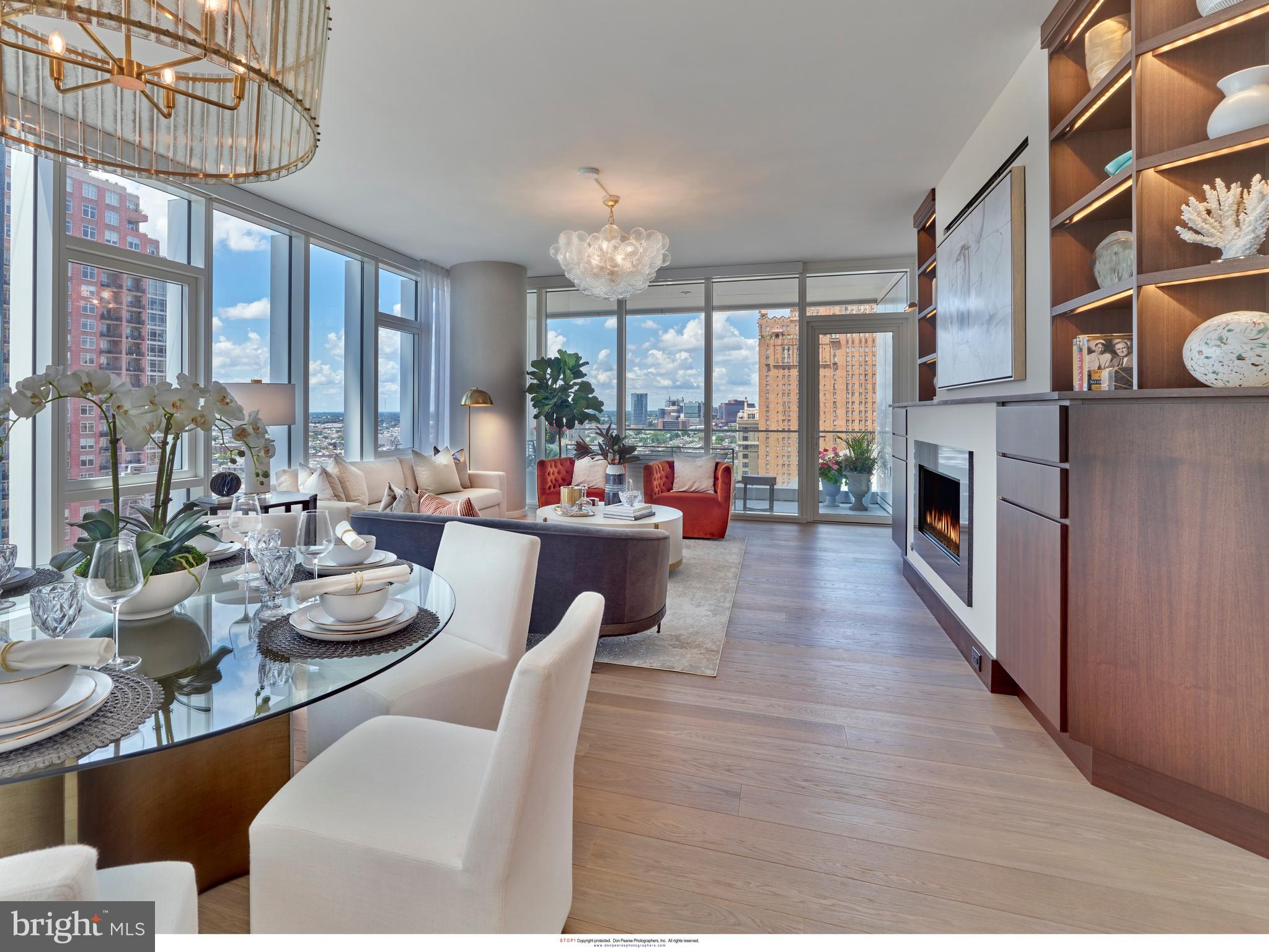 Arthaus, a commanding new residential high-rise in Philadelphia’s renowned performing arts district, presents Unit 1104: a stunning 2-bedroom, 2-bath, 1,730-square-foot single-level residence with direct views of the Kimmel Center for the Performing Arts, offered at $1,530,000.

This maintenance-free, move-in ready home delivers elevated interior design, resort-style amenities, and white-glove service. A tax abatement is in place, making this an exceptional opportunity for discerning buyers—whether a full-time resident, pied-à-terre owner, or global traveler.

From the moment of entry, Arthaus makes a lasting impression. A tall solid-core wood door with refined hardware opens to a spacious, light-filled foyer, complete with a large coat closet, full hall bath, and dedicated laundry room. Beyond, the expansive great room unfolds—seamlessly integrating kitchen, living, and dining spaces beneath soaring ceilings and framed by floor-to-ceiling windows. Wide-plank Havwood flooring and a weather-protected private balcony enhance the experience, while abundant natural light creates an airy, voluminous feel well beyond its footprint.

The chef’s kitchen is designed for both everyday living and effortless entertaining. A generous center island with seating for four anchors the space, complemented by two-tone Poggenpohl cabinetry in Polar White and Silver Ash, and striking Golden Gate quartz countertops with a full-height matching backsplash. The fully integrated appliance suite includes Wolf, Sub-Zero, Bosch, and Asko, delivering both performance and a clean, seamless aesthetic.

Privately situated on the west side of the residence, both bedrooms offer comfort and quiet. The guest bedroom features a walk-in closet and sweeping views of the Kimmel Center. The adjacent full bath is appointed with Calacatta porcelain tile flooring, Super White quartz countertops, and matte Polar White Poggenpohl cabinetry.

The owner’s suite is a true retreat, wrapped in 10-foot floor-to-ceiling windows and offering two generous step-in closets. The spa-inspired bath features a Badeloft soaking tub, double vanity with Robern mirrors, Super White quartz surfaces, Contempo white marble flooring and shower tile, and a private water closet with Kohler fixtures.

Arthaus is a modern architectural masterpiece by Carl Dranoff, designed by Kohn Pedersen Fox and constructed by Intech Construction. The building prioritizes wellness and lifestyle, highlighted by a Monet-inspired mosaic lobby and an exclusive amenity collection spanning the 6th and 7th floors—including a 75-foot indoor lap pool, state-of-the-art fitness center, spa, salon, pet park, landscaped terraces, and resident gardens.

White-glove services include a 24-hour doorman, concierge, chauffeured town car, and valet parking.

This residence includes one parking license. With the tax abatement, estimated annual real estate taxes are approximately $2,972.