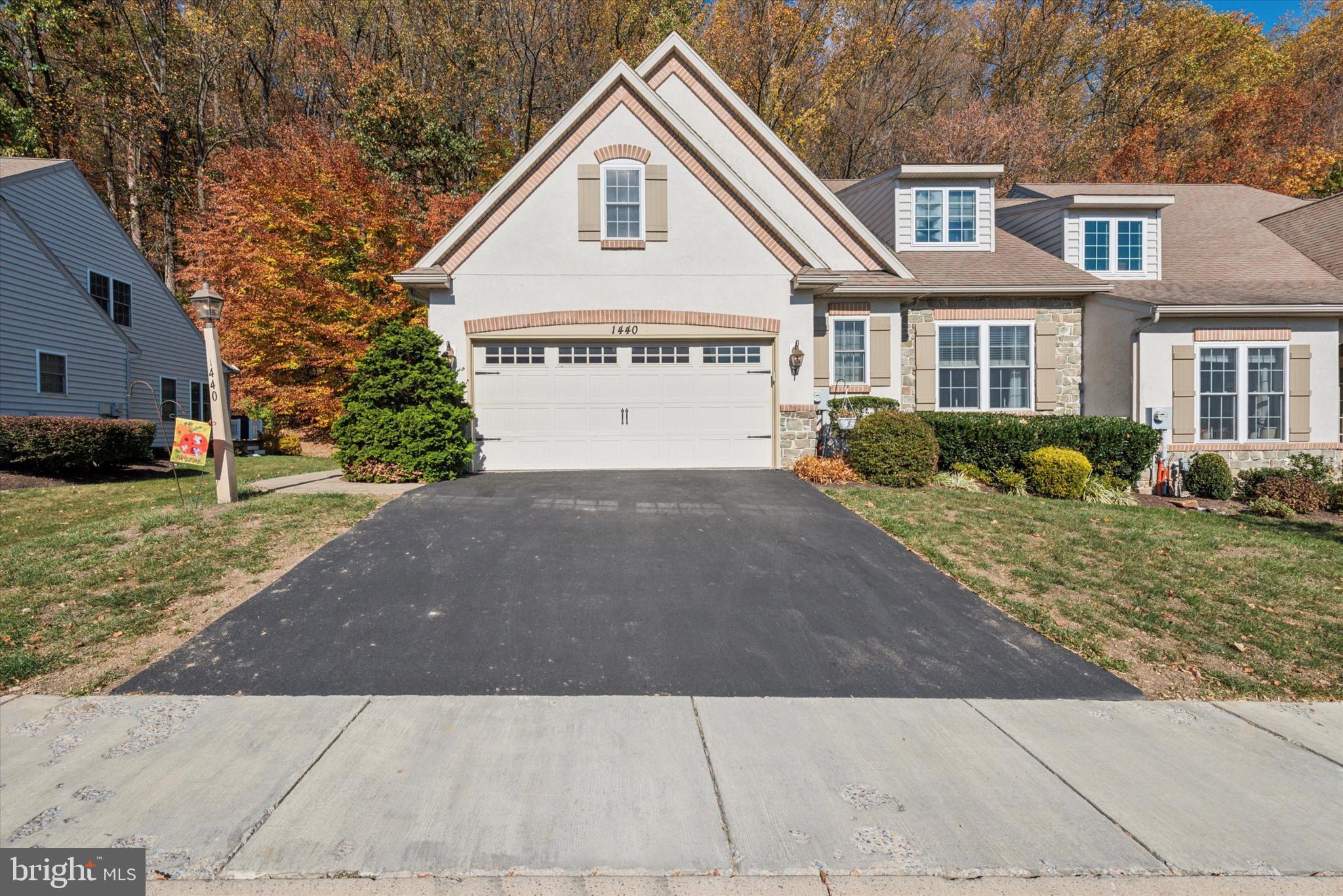 Welcome to your dream home in the highly sought after 55+ community of The Woods at Rock Raymond! This meticulously cared for end unit features a convenient 2-car garage and a spacious driveway, providing ample parking for you and your guests. Step inside to discover an open and bright main floor. The inviting living room boasts a cozy gas fireplace, creating a warm atmosphere for gatherings. The large eat-in kitchen showcases a center island and sleek stainless steel appliances, making meal prep a delight. Off the kitchen, sliding glass doors lead to the rear patio, perfect for outdoor entertaining. The master bedroom is conveniently located on the main floor and features a spacious walk-in closet with built-in shelves and an ensuite bathroom. The remaining bedrooms are also generously sized, equipped with carpet flooring, ceiling fans, and ample closet space. They share a Jack and Jill bathroom. Ample but low-maintenance back and side yards for pet owners! Don't miss the opportunity to call this beautiful home yours!
