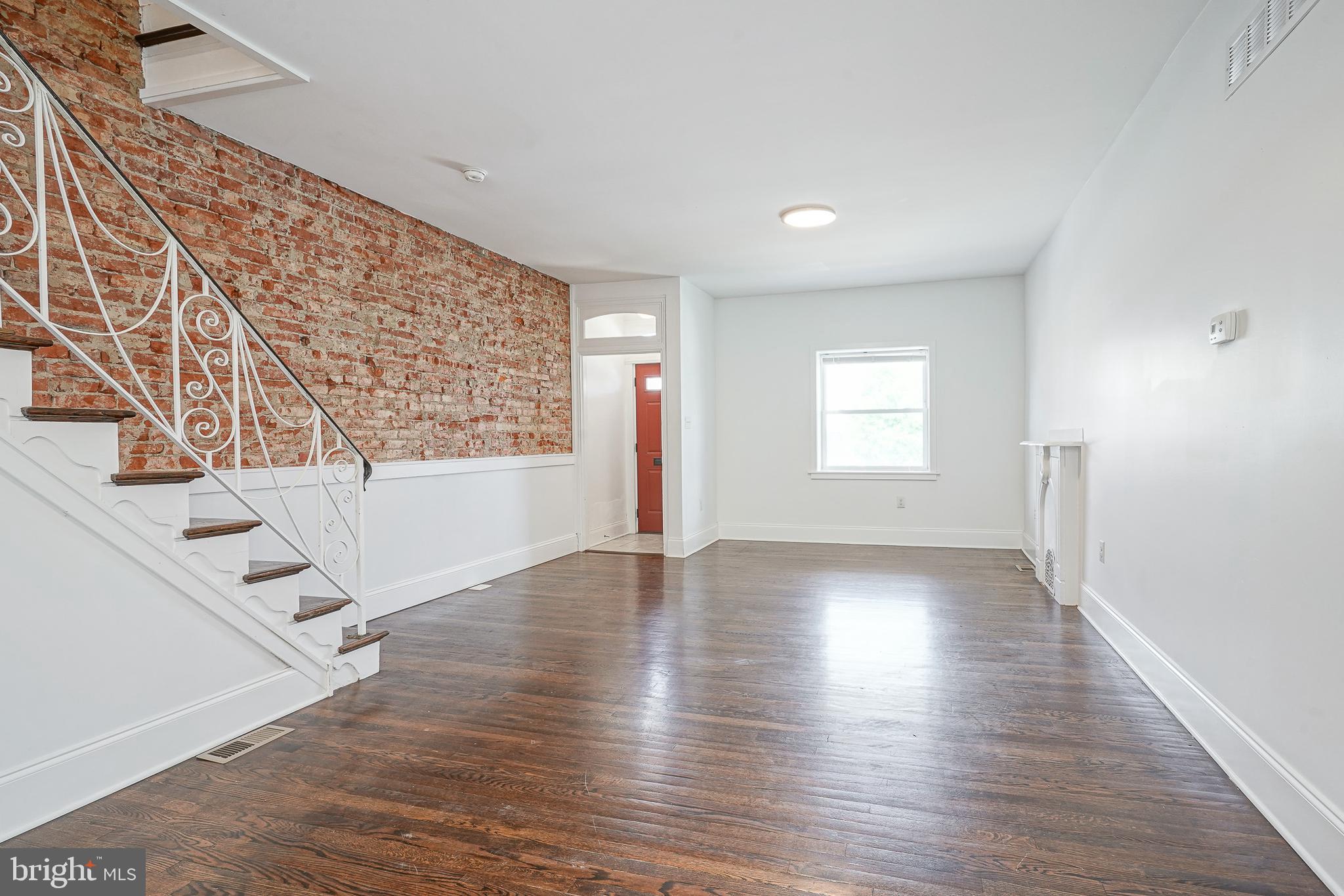 This is a beautifully renovated turn-key property ready for you to just move-in! You'll appreciate the mix of both original character and modern updates like central AC and recessed lighting. As you walk in from the covered front porch and through the vestibule, you will immediately notice the sprawling hardwood floors and exposed brick wall. In the rear of the first floor you'll enjoy a large, updated kitchen equipped with gas cooking and a dishwasher. Behind the kitchen you'll find a convenient half bathroom and storage closet. Exiting the home just past the powder room, you have a private fenced-in back patio/yard and side yard which extends all the way to the front of the home. On the 2nd floor you'll enjoy 3 large bedrooms, all of which are actually functional bedrooms! They all have hardwoods floors throughout and newer windows. Once you step outside the home, the location is extremely convenient. This address has a BikeScore of 87, TransitScore of 79, and a WalkScore of 82, so errands can be accomplished on foot. The Kingsessing Recreation Center, Kingsessing Library, and 49th St. rail station are just down the street. The property is vacant and can be seen on short notice!