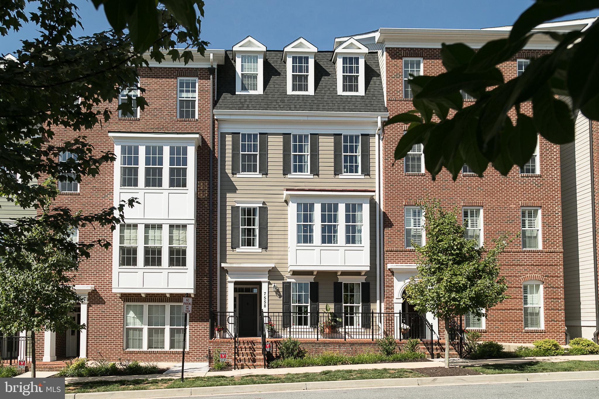 Welcome home!  This beautiful, spacious, 2-story town home in the sought-after Maple Lawn neighborhood is updated with custom features, extra roomy, and absolutely gorgeous.  The charming front entryway opens into the large, warm living room with huge, bright windows.  Follow the hardwood floors past the adjacent half bath.  Then it's up the stairs to the large, open concept main floor.  The custom designer kitchen has plenty of cupboard space   and yet it's filled with cheery sunlight.  Enjoy the large quartz counters and stainless-steel gas appliances, custom lighting, breakfast bar with seating.  The cozy, inviting family room has plenty of space for seating and family fun thanks to the custom build-out of the bay window!  The adjoining dining room is big enough for a large table and chairs.  Don't miss the new, sizable pantry! Follow the wood floors and high ceilings past the convenient laundry room to the master bedroom with lots of closet space and gorgeous views. The private master bath has a frameless shower, quartz counters, dual vanities.  The spacious 2nd bedroom has ample closet space and its own updated, full bath. Wait!  Don't forget the large 1-car garage with flooring, shelving, and newly-created, extra storage space conveniently up above your head!  In fabulous Maple Lawn   this is one you can't afford to miss!