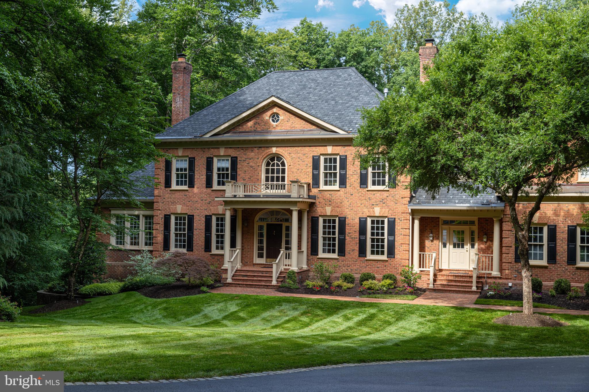 Welcome to 8600 Cathedral Forest Drive—a truly rare offering that redefines luxury living in Fairfax Station!

Properties of this caliber rarely become available. Privately tucked away on 5 breathtaking acres with direct access to Sandy Run & the Occoquan Reservoir, this extraordinary estate delivers a lifestyle that feels more like a private luxury resort than a residence. Every detail has been thoughtfully designed to create an experience that is impossible to replicate & nearly impossible to forget.

From the moment you arrive, the estate commands attention. The stately brick exterior, sweeping grounds, mature trees & impressive scale create an immediate sense of arrival. Step through the front door & you are welcomed by a dramatic curved staircase, soaring two-story foyer, rich hardwood floors, extensive millwork, oversized windows, & stunning architectural details.

Offering nearly 7,000 square feet of living space, 5 bedrooms, 5 full bathrooms, 2 half bathrooms, 4 garage spaces, a detached guest residence & one of the most spectacular entertainment levels in Northern Virginia, this home was designed for those who refuse to compromise.

The large gourmet kitchen features abundant cabinetry, stainless steel appliances, gas cooking, an oversized center island & a bright breakfast area overlooking the backyard oasis. The kitchen opens seamlessly to the breathtaking family room with soaring ceilings & a floor-to-ceiling stone fireplace. Formal living & dining rooms, a private executive office with custom built-ins, a sun-filled sunroom, hardwood floors, crown molding, chair railing, wainscoting, skylight & beautifully connected living spaces create the perfect balance of elegance & comfort.  A large laundry room & huge mudroom also make everyday living here super convenient! 

The luxurious primary suite serves as a private retreat featuring a sitting area, brick accent wall, a gas fireplace, walk-in closets & a spa-inspired bath. 4 additional bedrooms & 3 full bathrooms provide exceptional flexibility, including a 5th bedroom that can easily function as a recreation room, lounge, media room, or second office.

Designed to impress on every level, the walkout lower level showcases reclaimed Baltimore Stadium brick, dramatic architectural archways, a custom entertainment bar with wine refrigerator, dishwasher & ice maker, a dedicated wine cellar, game room, recreation spaces, movie viewing area, sauna, pool locker room, full bath, dedicated pool-entry mudroom, pool table, gaming tables, projector system & multiple gathering spaces designed for unforgettable entertaining. In addition most of the stunning quality furnishings such as the pool table, cus

Outside, the estate transforms into a private resort featuring a sparkling heated pool with a convenient electric pool cover, hot tub, outdoor fireplace, pergola, extensive hardscaping, multiple patios, professional landscaping, playground, expansive fenced grounds, outdoor television & direct personal access to Sandy Run & the Occoquan Reservoir for kayaking, fishing, paddleboarding & endless outdoor recreation.

An additional detached two-car garage with a private apartment above provides exceptional flexibility with a full kitchen, bathroom, & living space ideal for guests, multi-generational living, an au pair suite, private office, or home business. The attached garage features epoxy flooring & extensive storage. 

Additional highlights include fresh interior paint (2026), washer & dryer (2025), Gutter Helmet system (2020), an architectural roof (2019), dishwasher (2019), water heater (2016) & 5 updated HVAC systems, a generator backup, Bose surround sound, pus parking for 10+ vehicles & numerous luxury conveyances that create a truly turnkey experience.

This is more than a home. It is a destination, a retreat & one of the most unforgettable properties to come to market in Fairfax Station.  In addition, enjoy great schools & a quick & easy 4 min. commute option to #123.