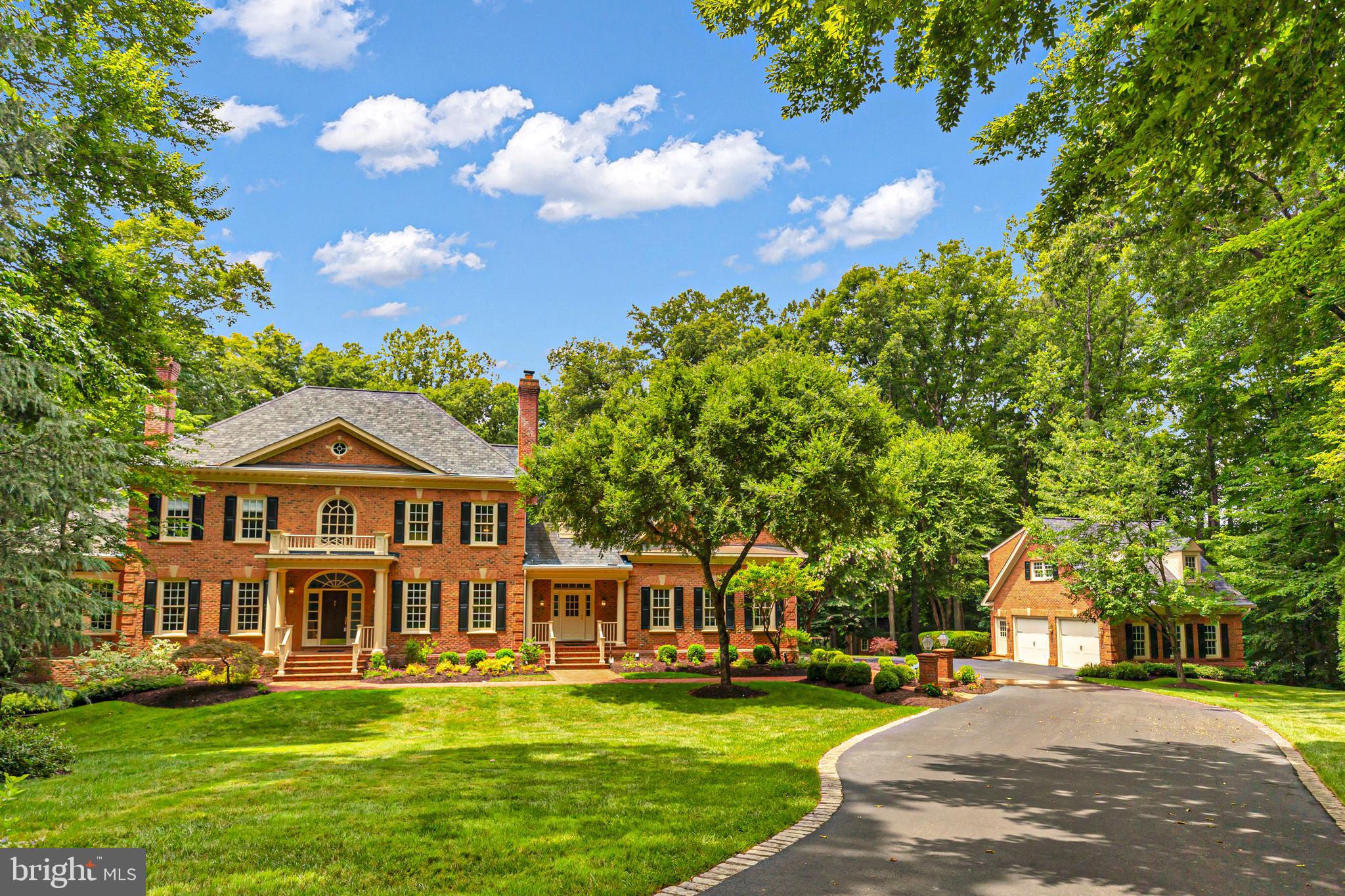 Welcome to 8600 Cathedral Forest Drive—a truly rare offering that redefines luxury living in Fairfax Station!

Properties of this caliber rarely become available. Privately tucked away on 5 breathtaking acres with direct access to Sandy Run & the Occoquan Reservoir, this extraordinary estate delivers a lifestyle that feels more like a private luxury resort than a residence. Every detail has been thoughtfully designed to create an experience that is impossible to replicate & nearly impossible to forget.

From the moment you arrive, the estate commands attention. The stately brick exterior, sweeping grounds, mature trees & impressive scale create an immediate sense of arrival. Step through the front door & you are welcomed by a dramatic curved staircase, soaring two-story foyer, rich hardwood floors, extensive millwork, oversized windows, & stunning architectural details.

Offering nearly 7,000 square feet of living space, 5 bedrooms, 5 full bathrooms, 2 half bathrooms, 4 garage spaces, a detached guest residence & one of the most spectacular entertainment levels in Northern Virginia, this home was designed for those who refuse to compromise.

The large gourmet kitchen features abundant cabinetry, stainless steel appliances, gas cooking, an oversized center island & a bright breakfast area overlooking the backyard oasis. The kitchen opens seamlessly to the breathtaking family room with soaring ceilings & a floor-to-ceiling stone fireplace. Formal living & dining rooms, a private executive office with custom built-ins, a sun-filled sunroom, hardwood floors, crown molding, chair railing, wainscoting, skylight & beautifully connected living spaces create the perfect balance of elegance & comfort.  A large laundry room & huge mudroom also make everyday living here super convenient! 

The luxurious primary suite serves as a private retreat featuring a sitting area, brick accent wall, a gas fireplace, walk-in closets & a spa-inspired bath. 4 additional bedrooms & 3 full bathrooms provide exceptional flexibility, including a 5th bedroom that can easily function as a recreation room, lounge, media room, or second office.

Designed to impress on every level, the walkout lower level showcases reclaimed Baltimore Stadium brick, dramatic architectural archways, a custom entertainment bar with wine refrigerator, dishwasher & ice maker, a dedicated wine cellar, game room, recreation spaces, movie viewing area, sauna, pool locker room, full bath, dedicated pool-entry mudroom, pool table, gaming tables, projector system & multiple gathering spaces designed for unforgettable entertaining. In addition most of the stunning quality furnishings such as the pool table, cus

Outside, the estate transforms into a private resort featuring a sparkling heated pool with a convenient electric pool cover, hot tub, outdoor fireplace, pergola, extensive hardscaping, multiple patios, professional landscaping, playground, expansive fenced grounds, outdoor television & direct personal access to Sandy Run & the Occoquan Reservoir for kayaking, fishing, paddleboarding & endless outdoor recreation.

An additional detached two-car garage with a private apartment above provides exceptional flexibility with a full kitchen, bathroom, & living space ideal for guests, multi-generational living, an au pair suite, private office, or home business. The attached garage features epoxy flooring & extensive storage. 

Additional highlights include fresh interior paint (2026), washer & dryer (2025), Gutter Helmet system (2020), an architectural roof (2019), dishwasher (2019), water heater (2016) & 5 updated HVAC systems, a generator backup, Bose surround sound, pus parking for 10+ vehicles & numerous luxury conveyances that create a truly turnkey experience.

This is more than a home. It is a destination, a retreat & one of the most unforgettable properties to come to market in Fairfax Station.  In addition, enjoy great schools & a quick & easy 4 min. commute option to #123.