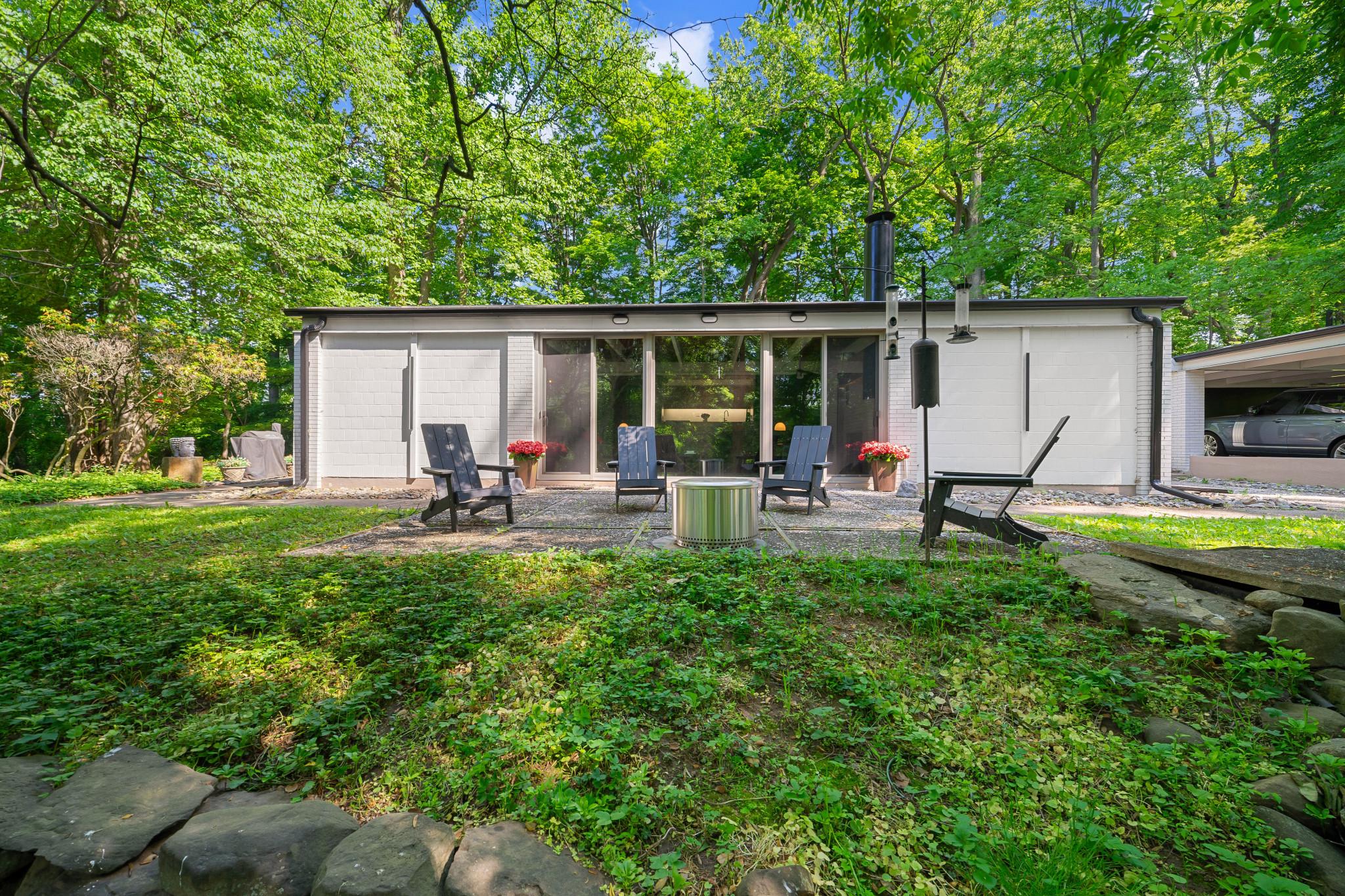 Some homes are built. This one was conceived.
Designed in 1961 by architect P.T. Astore and honored that same year with a national award for residential design, 3705 Darby Road is one of the Main Line's most architecturally significant properties — a Frank Lloyd Wright vision of modernism set on nearly two private acres in Bryn Mawr.
The philosophy is immediately apparent: this home does not separate you from the natural world — it dissolves the boundary between the two. Floor-to-ceiling and transom windows wrap the interior in shifting light and seasonal color. A long private drive rises to meet the house, which sits elevated above a private reserve, with surrounding woodland and a koi pond below the patio. The world quiets here.
Inside, the integrity of Astore's original vision remains intact. Concrete walls and original concrete floors ground the space. Cedar plank ceilings lend warmth. A dual door fireplace between the dining and living rooms,  and an open kitchen-dining-living plan speak to a designer who understood, decades ahead of his time, how people actually want to live.
The home's signature symmetry offers genuine flexibility — four bedrooms, multiple home offices, or any configuration that suits your life.  Authentic glass shower tile, and a unique l shape to the bathrooms delight. Dual-zone gas heat and air conditioning, a detached carport with storage shed complete the picture.
Plus, the train to Center City or Manhattan is minutes away. Suburban Square, acclaimed restaurants, and leading universities are close at hand. Serenity and connectivity, in rare and deliberate balance.
Opportunities like this do not repeat themselves.