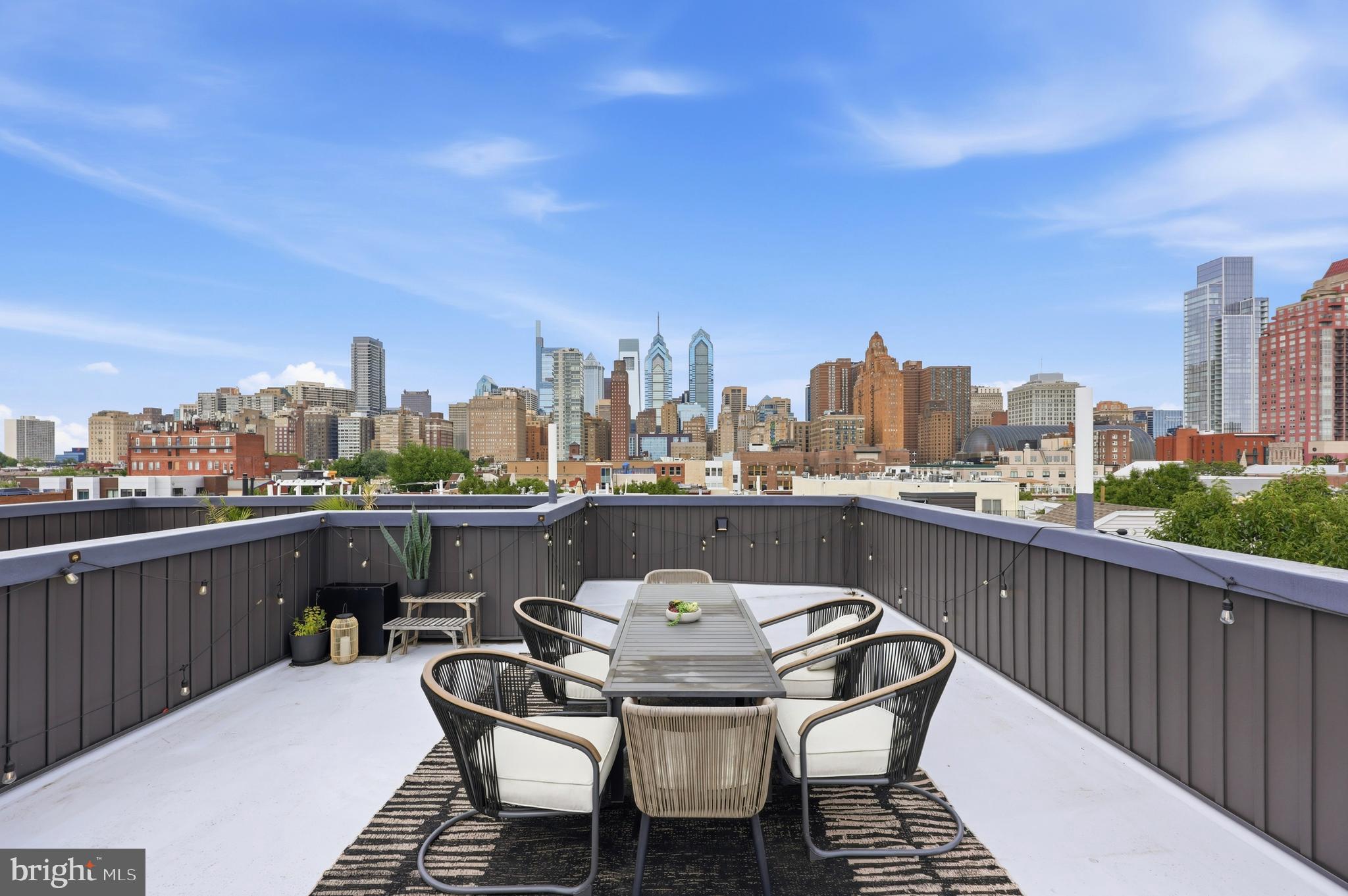 Dramatic Views of the City! Walkability 100! Make this 4 year young condo in the heart of Graduate Hospital your new home!
Access this home through a secure, gated entrance.
Maintained and loved by the original owner, this 2 bed, 2.5 bath condo has it all. Main level open concept living. Gourmet kitchen with all of the modern amenities, gas cooking, pot filler, plenty of counter space for all your cooking and entertaining needs. Built in electric fireplace for comfy winter nights. Large windows allow this main level to feel bright. Powder room and laundry conveniently located on the main level.
Light colored hardwood floor throughout make the staircase to the second floor feel bright and open. Second level you will find high ceilings and a modern, fresh hall bath. The primary bedroom has large closet   and luxurious en suite with double sink and shower and plenty of storage. The second bedroom is bright with lots of light from large window and high ceilings The wet bar sits on this level for ease and convenience to the grandest feature of all......the ROOFTOP!!! Once on the rooftop, you feel like you can touch the city! The view is panoramic, unobstructed and clear. The extra-large patio area adds living space to this "like new" city condo. 
Access to a hose bib and plenty of electrical outlets on the rooftop installed for convenience.
The walkability is ridiculous! The city is at your fingertips with this condo. Restaurants, coffee shops shopping, a brief walk to South St and center city! 
Furniture is Pottery Barn, Restoration Hardware and West Elm and is negotiable to stay with home.
A 6 year tax abatement as well.