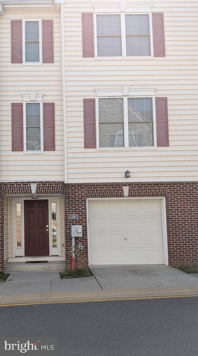 Motivated seller!!!   New Price and new opportunity to make this house your new home!!  Welcome to 118 McMullen Circle, this is the home you have been waiting for. A  beautifully updated home offering comfort, space, and convenience.
As you enter, you’re greeted by a spacious foyer on the main level. This level also features a versatile finished room, currently used as a family room and workout space—perfect for adapting to your lifestyle needs.  Upstairs, a wide and light-filled staircase leads to the main living area. The open-concept living and dining room creates an inviting atmosphere, ideal for entertaining family and friends. The generously sized kitchen boasts ample cabinet and counter space, along with room for a casual dining set. Recent updates include new LVP flooring and carpet in the bedrooms, modern light fixtures, a newer dishwasher and range (both less than one year old), and a programmable thermostat for added efficiency.  The bedrooms are cozy yet spacious, providing comfortable retreats. The primary bedroom features a walk-in closet and an en-suite bathroom with plenty of space.  Enjoy the convenience of a new library within walking distance (opening soon), along with nearby restaurants, grocery stores, shopping options and parks offering free summer concerts. There are 2 parking areas for overflow parking.  Commuters will appreciate the easy access to I-495 and I-95.  Don’t miss this opportunity—schedule your tour today!