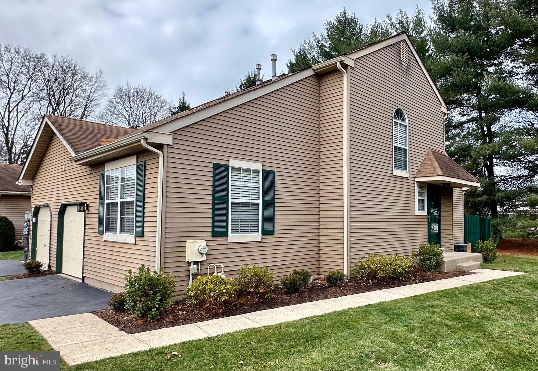 Welcome home to this beautiful, NEWLY-UPDATED end unit townhome in scenic Heacock Meadows.  
Features 2 bedrooms, 2 updated baths, an updated kitchen with granite (River White) countertops & stainless steel appliances. 
Large, open first floor  with elegant hardwood for living room/family room adjacent to the dining room with high ceiling.  Through the 8-pane glass door is the first bedroom & full bath. Upstairs you will find a spacious bedroom/loft and full bath with a surprisingly large walk-in closet. Extremely spacious basement is almost fully-finished leaving two large storage rooms. Off of the dining room are sliding doors leading to the private backyard and a lot more space on the side of the house. And lastly is the garage with newly epoxy-coated flooring. 

Perfectly located in Lower Makefield Township, this community offers walking distance access to shopping and restaurants, a new community pool, tennis courts and access to all that Bucks County has to offer. There is little turn over in this community, especially for an end-unit like this one.