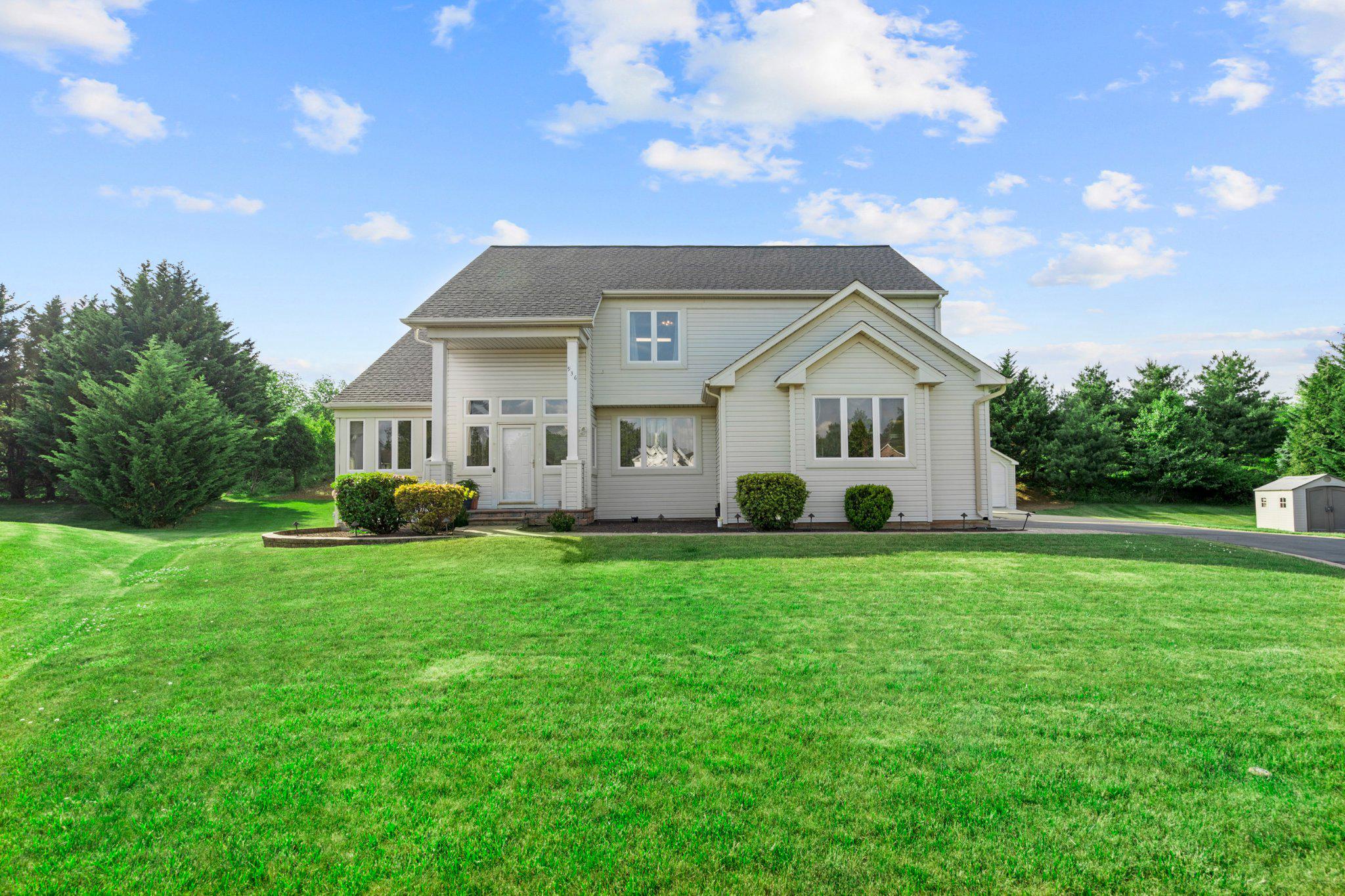 Nestled in the charming Hickory Ridge subdivision, this stunning Colonial-style home offers a perfect blend of comfort and elegance. Built in 1999, this meticulously maintained residence boasts 2,999 square feet of finished living space, making it an ideal sanctuary for those seeking both style and functionality. Step inside to discover a warm and inviting interior featuring a traditional floor plan that seamlessly connects the living spaces. The heart of the home is the cozy ceramic tiled flooring kitchen, complete with an eat-in area, Gas cooking range with double ovens, and a pantry, perfect for culinary enthusiasts. The adjoining high ceiling family room, enhanced by a cozy gas fireplace with glass door, & a powder room creates an inviting atmosphere for gatherings and relaxation. Crown moldings and hardwood floors add a touch of sophistication throughout the main level. This home offers four generously sized bedrooms, including a primary suite on main level with a luxurious soaking tub and walk-in closet, ensuring ample space for personal retreat. With two full bathrooms and two half baths, morning routines will be a breeze for everyone. The convenience of a second kitchen with natural gas cooking range in the fully finished basement opens up possibilities for entertaining or accommodating guests. The exterior of the property is equally impressive, featuring extensive EP Henry hardscaping, a well-maintained lawn, and a welcoming porch. Enjoy outdoor private living on the patio, perfect for summer barbecues or quiet evenings under the stars. The cul-de-sac location provides a peaceful setting with minimal traffic, while the attached oversized garage offers additional storage and easy access to the home. Safety and efficiency are prioritized with energy-efficient double-pane windows, an interior fire sprinkler system, and Siemens natural gas powered 16KW generator & security features, including smoke and carbon monoxide detectors. The property also includes an Tesla electric vehicle charging station, catering to eco-conscious buyers. With an adequate lot size & a 12x24 size vinyl garage shed, this home offers a front yard that invites outdoor play and relaxation. The paved driveway provides ample parking for guests, ensuring convenience for all. This exceptional property is not just a house; it's a place to create lasting memories. Experience the perfect blend of comfort, style, and functionality in this beautiful Hickory Ridge home. Don't miss the opportunity to make it yours!