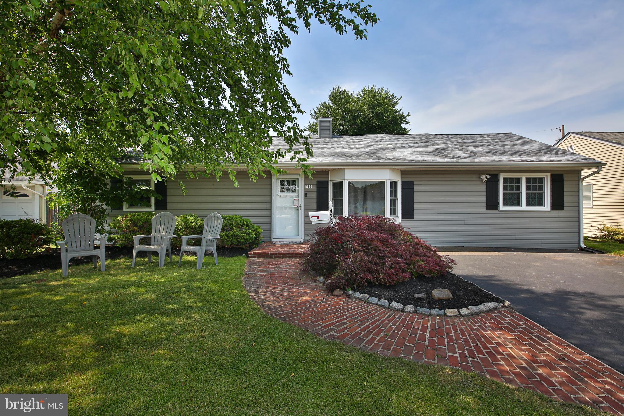 Welcome to 423 Chelsea Road, a beautifully expanded ranch home located in the award-winning Pennsbury School District. Offering 3 bedrooms and a versatile floor plan, this home combines comfortable everyday living with exceptional entertaining space.

At the center of the home, you'll find a spacious kitchen with ample cabinet storage, making meal preparation and family gatherings a breeze. The adjacent dining room features elegant chair rail molding and flows seamlessly into the main living areas, creating an open and inviting atmosphere. Recessed lighting throughout the home adds a bright, modern touch.

The standout feature is the impressive approximately 15' x 35' family room addition, complete with soaring vaulted ceilings and a large bar area designed for entertaining. Whether hosting game days, holiday gatherings, or casual get-togethers, this space offers endless possibilities. A separate office provides the perfect work-from-home setup, hobby room, or flex space to fit your needs.

Step outside to your own backyard oasis. The expansive 14' x 18' paver patio is ideal for outdoor dining and relaxation, while the fully fenced yard offers privacy and plenty of room for pets, play, or gardening. An oversized shed provides excellent storage for tools, equipment, and seasonal items.

Major updates provide peace of mind, including a newer roof and siding (2022) and a newer central air conditioning system (2022).

Conveniently located near shopping, dining, parks, and major commuting routes, this expanded Fairless Hills rancher offers the perfect combination of functionality, entertaining space, and value in one of the area's most sought-after school districts.