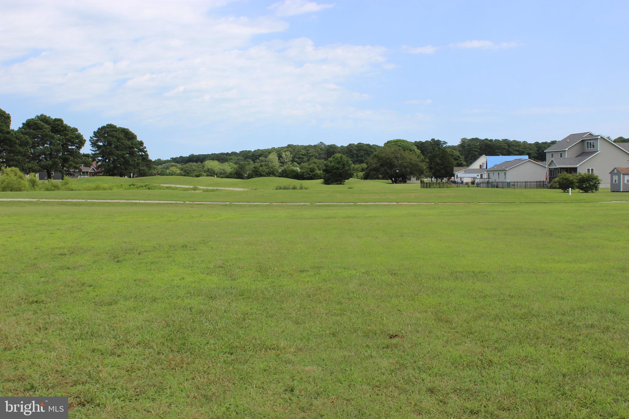 2/337 Cleared, level, oversized (11,406 sq ft.,) golf course lot overlooking the 5th Tee Box and pond. Plat, Cert letter for a 4 BR, and Wetland Determination Study on file. Close to all the amenities. Pick your builder, no builder tie-in and no time frame to build, start enjoying life on the Eastern Shore of VA. Come and enjoy all the amenities and the lifestyle on the Eastern Shore of VA. Captains Cove is the Eastern Shore of Virginias fastest growing Golf & Waterfront community. Close to Chincoteague Island, Wallops Island and Ocean City MD. HOA amenities: 9 Hole Pristine Golf Course, indoor/outdoor pools (2), fitness center, basketball & pickle-ball courts, boat ramp, docks, playground, walking & biking trails, dog park, security and so much more. Call for information