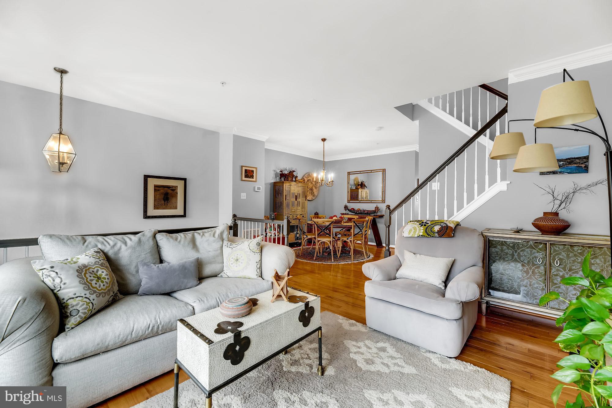 Rare find in historic Woodberry. This gem is located in Clipper Mill which is tucked away under Interstate 83, but is conveniently juxtaposed to Hampden making it one of Baltimore's best kept secrets. The community is the epitome of urban upscale living, and this home shows like a model. There are gleaming hardwood floors; rays of natural sunlight glaring throughout complimented by exquisite window treatments; an open floor plan on the upper level is conducive for social gatherings with  a gourmet kitchen, which leads to the exterior deck to accommodate any overflow and take in scenic views of the community, mills and skyline. It is the only unit that varies  from your traditional open loft floor plan. The versatility of the 4th bedroom offers convenient access with no steps because it is on the main level  off the entry, or it can be used as  an in-law suite. Other amenities such as vaulted ceilings, dual vanities, a sunken tub, walk-in closet, built-in shelving (for additional storage),  recessed lights, marble fireplace, and corian counters with black appliances are the embodiment of endless character which is only the tip of the iceberg. The exterior red brick with the attic enhances the curb appeal. Parking is plentiful for residents and guests with a two car garage and driveway adjacent to overflow parking. Don't have a green thumb? No worries...the HOA fees cover lawn maintenance, security and indulgence in the unique Roman style community pool & hot tub. Order poolside from the world renowned Woodberry Kitchen, which is literally a few feet away. Investment in this community is not just a purchase of a home but a way of life. Whether it is fine dining of every imaginable cuisine at La Cuchara, Food Market, Cosima, Charmery, Dangerously Delicious Pies, breweries, distillers; nightlife, entertainment and activities at Corradetti Glassblowing Studio & Gallery, the Jones Falls Trail, the Avenue in Hampden, Mt. Washington, The Rotunda, Round Falls waterfall, Whitehall Mill; schools such as Roland Park, Polytechnic, Loyola University, MICA; and accessibility to the light rail and I-83, they are all within walking distance.