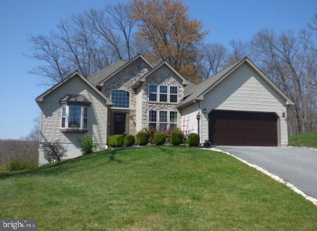 No place like home, when home is this beautiful 3BR, 2BA contemporary ranch set on a cul-de-sac lot. You'll fall in love with the elegance and comfort this home offers. Enjoy your morning cup of coffee in the 4-seasons room overlooking a wooded backdrop. Step outside and enjoy being one with Mother Nature or taking in the view. Home showcases wonderful features... soaring ceilings, granite kit, spacious master suite, and 1/2 daylight lower level.