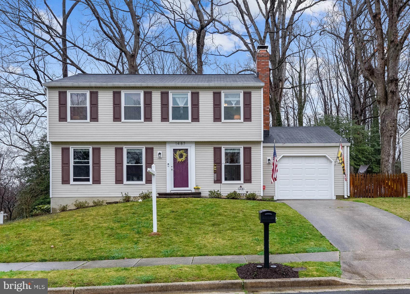 PRIME OPPORTUNITY to OWN in ANNAPOLIS and in the Desired BROADNECK School District! The Single Family Home Neighborhood of "Whispering Woods" is pleased to present this MUST SEE Beautiful Colonial!! 4 Bedrooms with 5th Bedroom in the Newly Finished lower level... tastefully done with New Frize Carpet and Built-Ins!  Main level has Wood floors, Wood Burning Fireplace, Eat-in-kitchen, Stainless Steel Appliances (NEW Dishwasher) and sliding door leading to rear Deck.  Upper level offers LARGE Master Suite with Full Bath, 3 other Spacious Bedrooms, 2nd Full Bath, Linen closet and a super cool Laundry Chute! The Lower Level is perfect for play room, office space, bedroom & workout area... huge Laundry area with Stainless Steel Washer and Dryer ! Extra unfinished area in lower level for more storage! Attached One Car Garage with NEW Garage Door for your car, all those toys, storage and/or workshop!! NEW Fenced in Backyard w/tons of space for Gardens/raised beds, Firepit area, Swing set & more.... ALL NEW Siding & Shutters, ALL NEW Windows, Newer Roof, NEW HVAC & More! Close to Parks, Shopping, Schools and an Easy commute to Balto & DC with close proximity to RT 50 and RT 2. Super close to DOWNTOWN Annapolis & the Naval Academy! Don't Delay- make your appointment TODAY!!