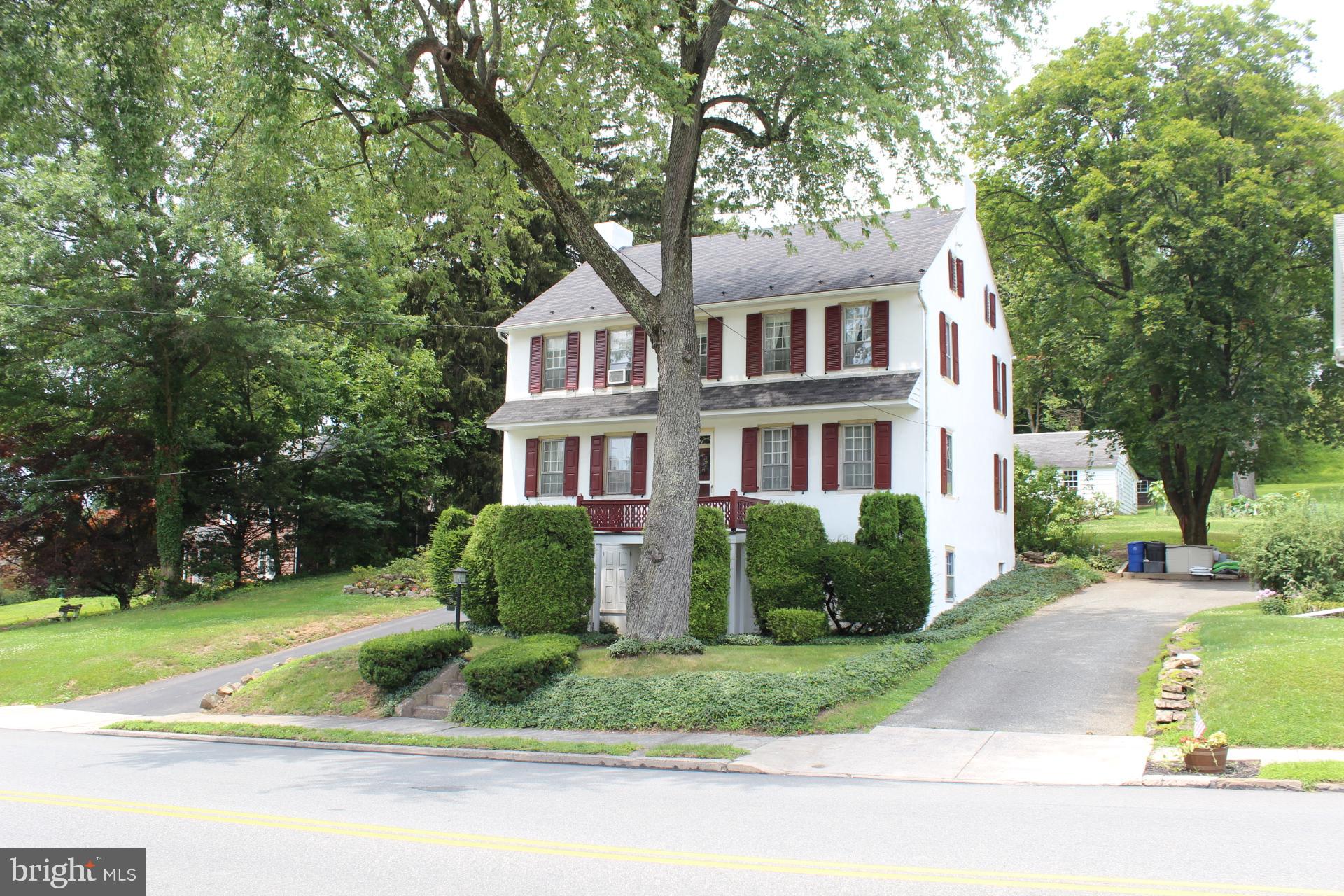 One of a kind rare opportunity to own a historic Boyertown Home dating back to 1,700's. Welcome to this stately, timeless colonial home dating back to 1,700's, situated on .33-acre property. Features include spacious formal living basked in natural light, dining room w/original random plank hardwood floor, chair rail and chandelier w/dining.  Fully remodeled custom eat-in kitchen w/solid wood cabinetry, Corian counters w/undermount double sink, glass top cooking, dishwasher and dining area overlooking rear yard and covered patio.  The traditional wood turned staircase leads to the second-floor landing providing access to master bedroom suite w nicely sized closet overlooking rear yard. Second bedroom w/built in bookcases and double desks. Two additional bedrooms provide addition options for growth and family as well as center hall full bath.  Lower lever office/den w/full walk-in fireplace and pine paneling is ideal for work from home office or study area.  There is second finished room (currently used as storage room) that can provide additional living area w/ many uses.  Original home had Two (2) front entrances on ground level and steps leading to main level of home.  Unfinished basement laundry / utility room, 200-amp electrical service.  Home is meticulously maintained, inside and out and truly a one-of-a-kind home.  Detached two car garage, w/workshop, and beautiful yard.  Centrally located minutes schools, shopping, entertainment, and major arteries.