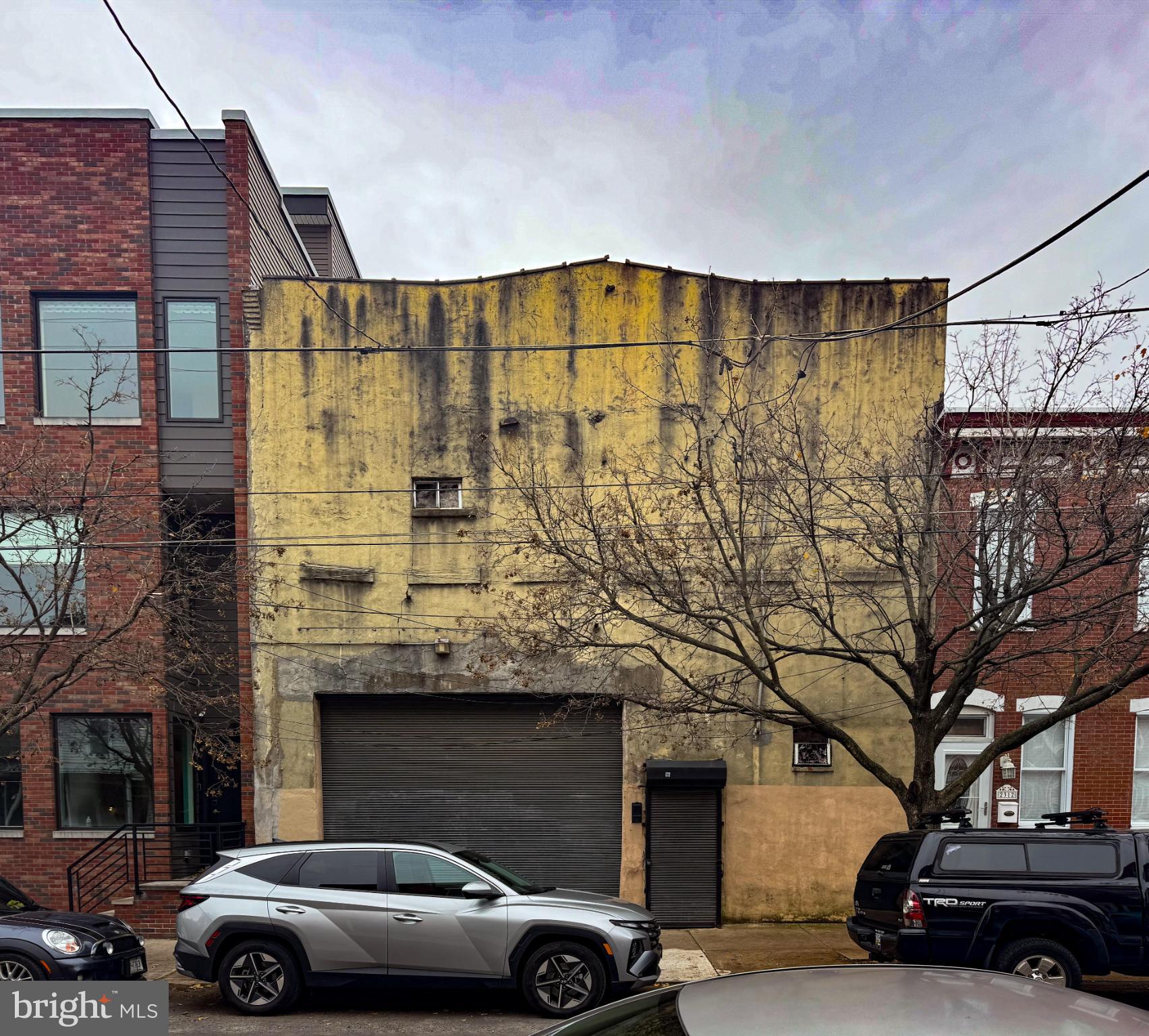 Investment Opportunity in Fishtown! 
**Prime Residentially Zoned Property with Significant Potential**
This residentially zoned property, situated in vibrant Fishtown, offers a compelling investment opportunity. The area is renowned for its dynamic growth, making it an attractive option for investors seeking urban properties with strong development potential.
**High Demand and Desirable Location**
Fishtown continues to experience demand for large, well designed residential spaces. This demand is fueled by the neighborhood's appealing lifestyle offerings, which include a diverse array of dining options, entertainment venues, and artistic attractions. These amenities contribute to the area's popularity, positioning this spacious, street-to-street property as an excellent candidate for capital investment.
**Unique Features and Opportunities**
This property stands out due to the substantial amount of land and square footage available on a single deed. With street frontage on both Norris and Susquehanna, it presents a unique opportunity for investors. The layout makes it ideal for either renovation or redevelopment projects, allowing for flexible approaches to maximize value.
** Key Details**
This property encompasses approximately 6,775 square feet of land, and 8,122 raw square feet of garage-type space all held under a single deed. The lot is believed to have once consisted of two separate parcels. Currently, there are at least two known surface drains on the property, which are assumed to be connected to a sewer line; however, explicit documentation confirming this connection is not available.
The site features one main structure, which is configured as two adjoining storage-type buildings. The entrance to one of these buildings faces Norris Street. The other structure, oriented toward Susquehanna Avenue, has been utilized as a garage and includes a roll-down door. This portion of the property is storied to have previously operated as an auto shop, a use reflected in its design, including a ramp that once allowed vehicles to access the second floor. Over time, the roof has partially collapsed and the status of the ramp cannot be confirmed.
No representations have been made regarding the legal use or status of the garage. Prospective buyers are responsible for conducting their own due diligence to verify all aspects of the property. There is a toilet present within the structure, but the condition and functionality of the plumbing are undetermined.
Offers contingent upon an interior tour of the property will be considered. Only exterior viewing is permitted; no interior showings are allowed without a signed letter of intent and proof of funds. Please note that there are no written property disclosures available.