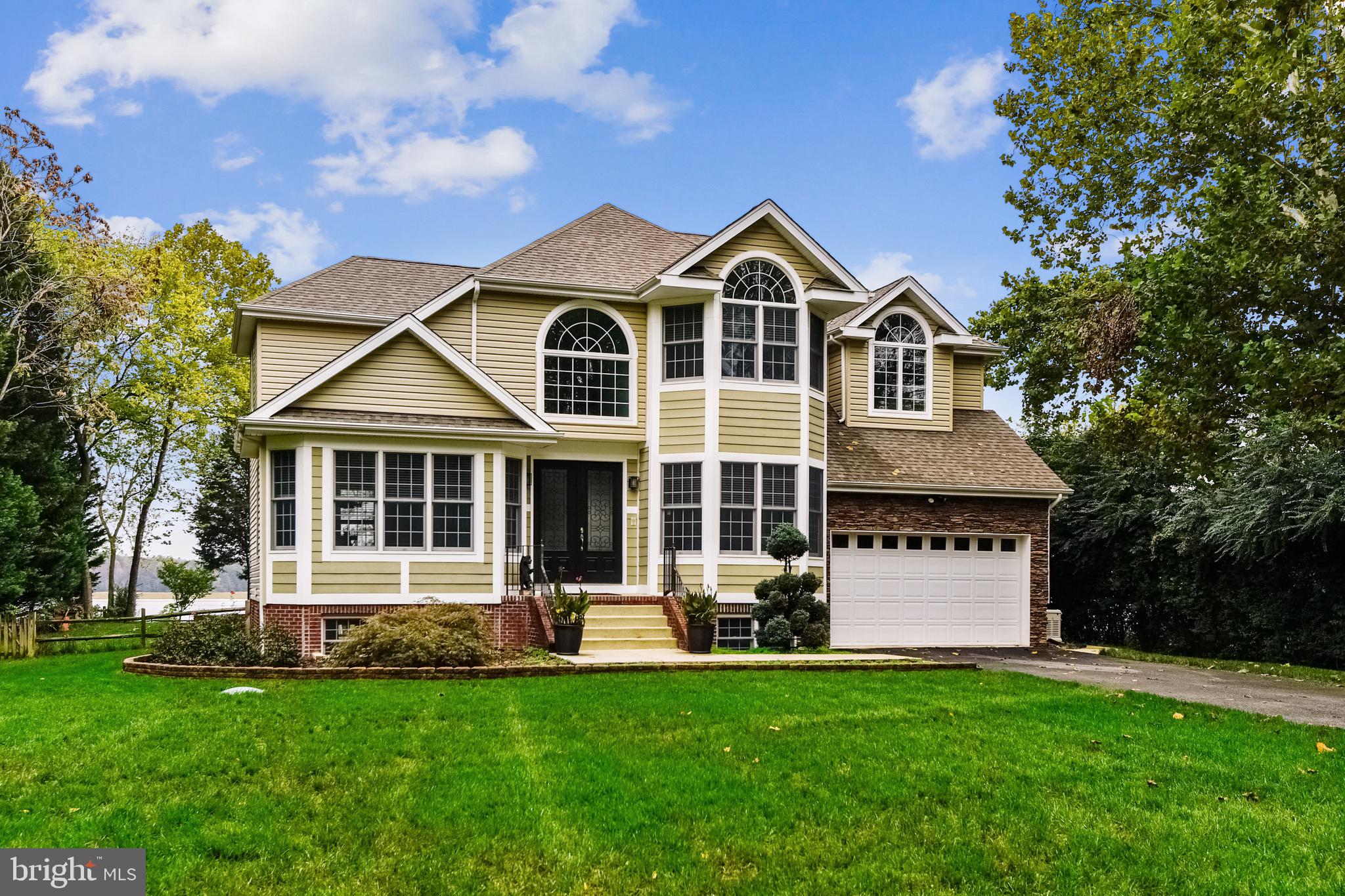 Waterfront Living! Custom-built beautiful waterfront home with waterviews from almost every room! Quick access to the Potomac River from your 100 foot private pier situated on peaceful Nanjemoy Creek. Pier equipped with electric, running water, two 30 amp plugs, 10,000 lb boat lift, two jet ski lifts, cleaning station, swimming pier with ladder, additional area for docking. A water enthusiast' dream! 30x40 steel sided and roofed pole garage with 10ft garage doors each with openers, 50amp plug for RV, 30amp plug, pellet stove, work bench and prepared for radiant floor heating. Perfect for boat storage, RV storage or holding all of a car enthusiast's cars! Beautifully landscaped lawn with mature trees, natural shoreline, pavers, rock beds, fully fenced yard, invisible fence for pets, multiple patios, tiki bar with fridge, built-in grill and tv, a firepit area, large gazebo with built-in speakers, composite deck for low maintenance with sunsetter remote controlled awning. An entertainer's dream! Enter the gorgeous home through two double-doors into the impressive two-story foyer. Hardwood floors throughout main level, recessed lighting, ceiling fans, 10ft ceilings with crown molding in all of the rooms, and custom blinds on all of the windows throughout the house. The main level features a gourmet kitchen with an island, stainless steel appliances, large all-wood soft-close cabinets, built-in pantry and wine rack. Family room with gas fireplace and sliding door to two-tier composite deck with entertaining area 16x16 and a 10x10 dining area. The upper level of the home offers spacious bedrooms with several vaulted ceilings and water views. The primary suite bedroom delights with a tray ceiling, gas fireplace, 2 walk-in closets with organizers, an ensuite bath with glass shower with tile, jetted tub, and double-vanity. A hall bath services the other 3 bedrooms and offers a double vanity and glassed shower/tub. A beautifully finished basement awaits you on the lower level with natural lighting, crown molding, wood floating floor, full bath with jet tub, windows throughout, storage closet with sink and cabinets, optional fifth bedroom with built-in bed. Entertain in your large recreation room with built in bar, kegerator, refrigerator, countertops and cabinets. Whole house Generac generator with two transfer panels, includes the dock and oversized detached garage. Whole house sprinkler system, dual zone American Standard HVAC units with maintenance plans, battery back-up sump pump. 30 year architectural shingled roof. No detail is overlooked in this entertainer and outdoor enthusiast's dream property! Please see this link for property floor plans and room views: tour.TruPlace.com/property/2232/92885/