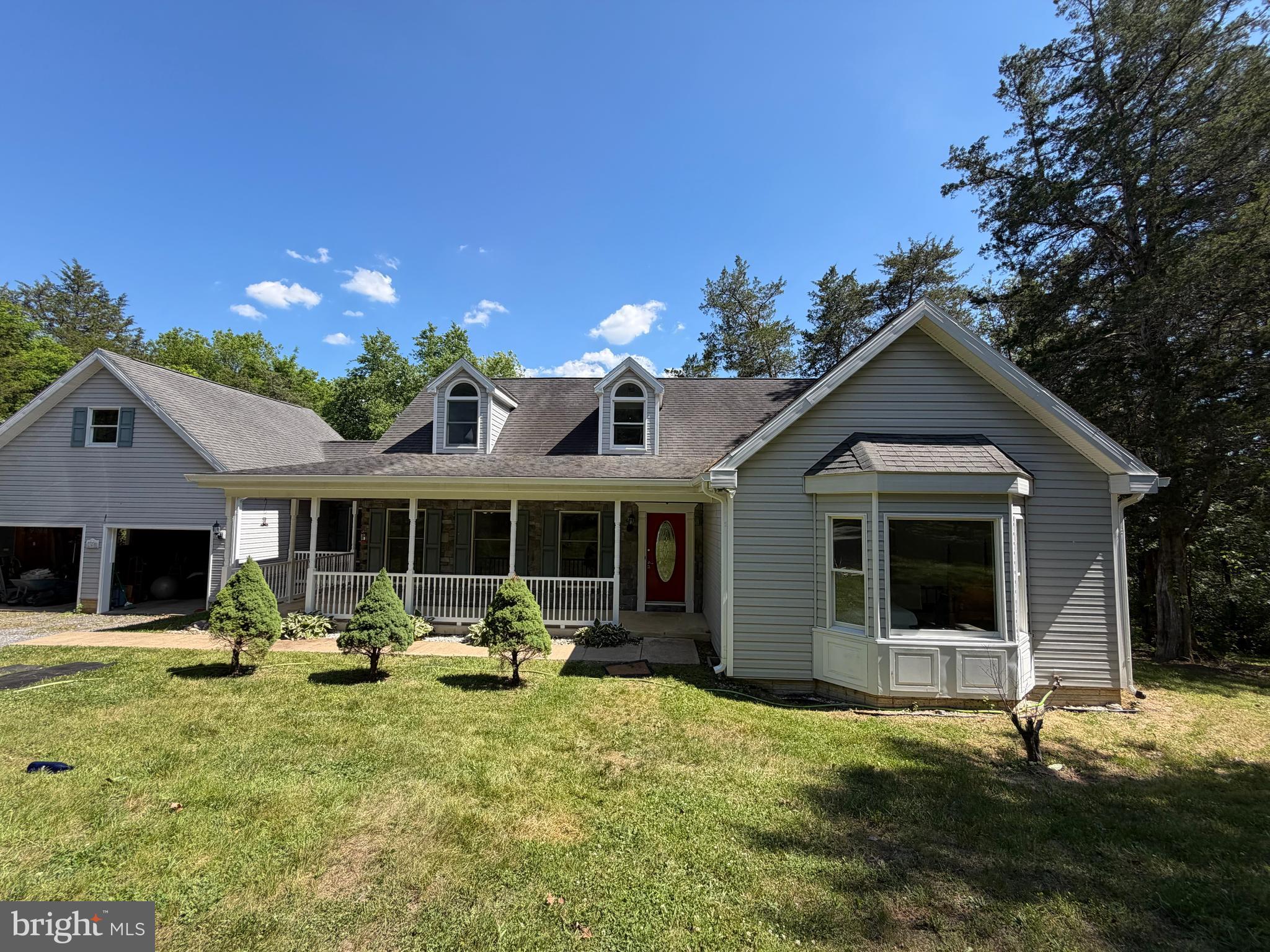 Enjoy this beautiful cape cod style property, located in the gated community of Greystone on the Opequon! This gated community of 92 properties, borders both sides of the Opequon Creek in Berkeley County, WV allowing property owners to have access to the Opequon for fishing, tubing, or canoeing. With being situated on a little over 5 acres, this property gives you an abundance of tranquility, and opportunity. As you enter, you are greeted with an a gorgeous open floor plan, with a conveniently located primary bedroom right on the main level. As you continue throughout the property, you will be welcomed to the kitchen that connects to the family room, allowing for easy entertainment for gatherings. Further along the kitchen, you have this wonderfully lit sun room, that overlooks the gorgeous greenery that surrounds you. Additionally, there is the finsihed basement, allowing for even more entertainment and storage. We welcome you 140 Coachman Run Rd!