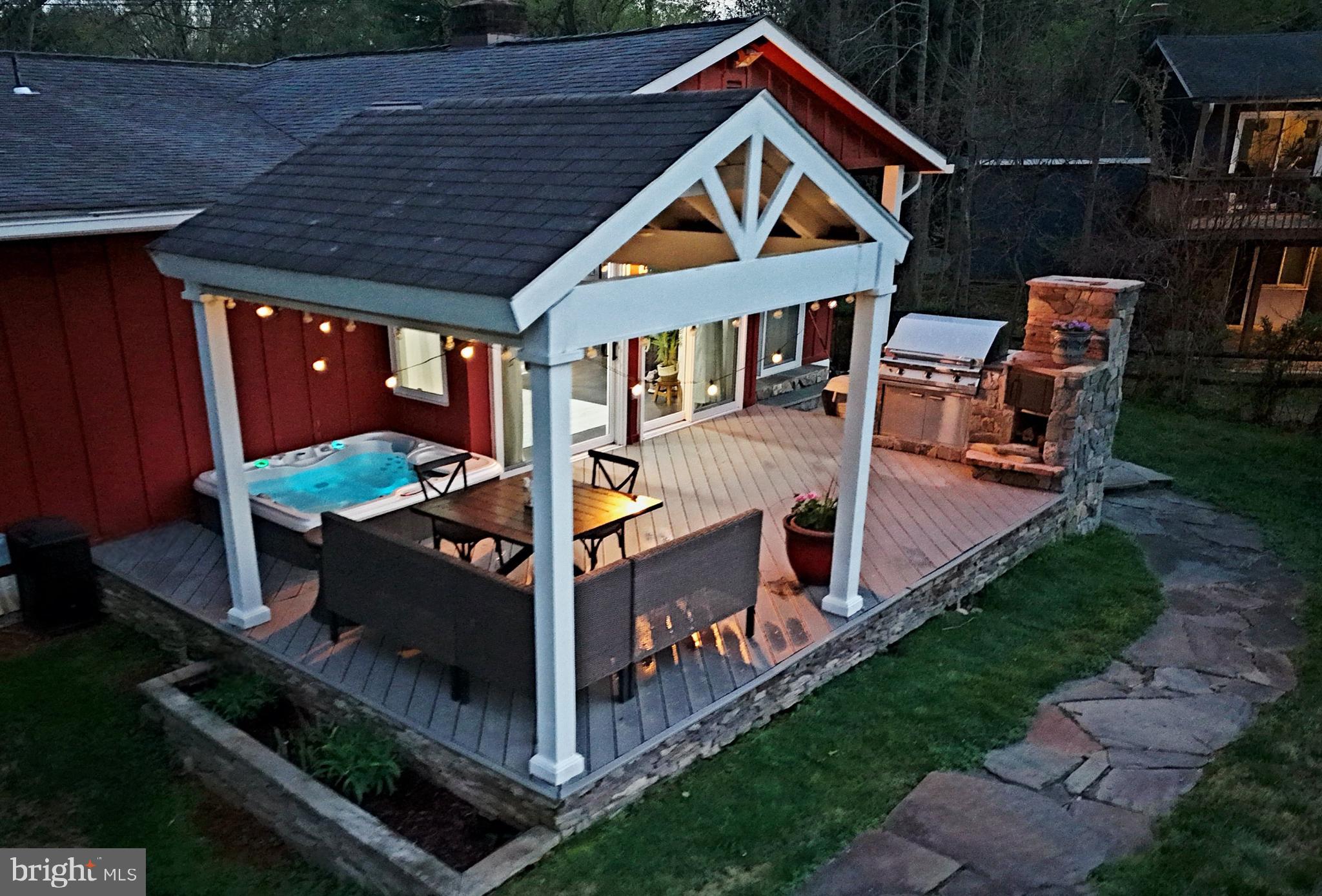 OPEN HOUSE 7/26,  2-4 ! BIG PRICE REDUCTION - Updates and renovations speak for themselves - Stunning home filled with upgrades & so much natural light.  Two level contemporary home with amazing square footage, an easy & open floor plan and sited on a quiet & picturesque lot.  See video and floor plans and hot tub! 

What a gem - the Kitchen & renovations are amazing!  Plus an open floor plan with two entrances to the Kitchen -from the Dining Room area & from the Family Room!  Discover refined contemporary living on a serene, professionally landscaped .37-acre lot in highly sought-after Glen Park community in Potomac—perfectly positioned in the top-rated Winston Churchill High School district.
Step inside this thoughtfully renovated home and feel the seamless blend of modern elegance and everyday comfort. Curb appeal shines with an expansive flagstone front patio framed by elegant stone walls, welcoming you home. 

DON'T MISS THE ATTACHED GARAGE WITH ENTRANCE FROM THE FRONT COVERED WALKWAY. 

The lower-level impresses with a bright, daylight recreation room featuring recessed lighting, custom millwork, a cozy wood-burning stove insert fireplace, and a wall of windows overlooking the lush yard. A versatile 4th bedroom (or ideal home office) includes a custom walk-in closet, recessed lighting, and clever under-bench storage. A designer full bath with soapstone-topped vanity, plus a convenient laundry room with sink, extended Quartz counters, cabinetry, washer/dryer, and utility space, completes this flexible level.

Ascend the custom contemporary stairway to the sun-drenched main level, where an open-concept layout flows effortlessly. The soaring-ceiling living room with hardwood floors opens to a front balcony via Andersen sliders. The dining room connects seamlessly to the chef’s kitchen and family room.
The upgraded kitchen is a standout with granite counters, GE Café French-door refrigerator, six-burner gas range with double ovens, custom range hood, Fisher & Paykel two-drawer dishwasher, stainless farmhouse sink, tile backsplash, abundant custom cabinetry, recessed lighting, and a built-in microwave. Adjacent breakfast area with Andersen sliders leads to a flagstone patio.

Unwind in the expansive family room spanning the rear, with recessed lighting, ceiling fan, and sliders to a low-maintenance deck and covered pergola. Outdoor entertaining reaches new heights with a built-in commercial grilling system, gas grill, custom wood oven, and a relaxing hot tub.

Luxury awaits in the primary suite: king-sized space with two large closets (one walk-in), ceiling fan, recessed lighting, and serene views. The spa-like primary bath features an oversized walk-in shower with bench, niche, shelf, and dual Quartz vanity. Two additional generous bedrooms offer walk-in closets, custom benches, ceiling fans, and recessed lighting. A renovated full bath with Quartz tops and tub/shower combo, plus two linen closets, serves the level perfectly.

Notable updates include: 50-year Owens Corning Architectural roof (2013); HWH (2019; HVAC (2014); compressor (2024); custom window treatments through-out the home, plus French drain at rear, and extra driveway parking.

Minutes to I-495, I-270, I-370, Bethesda, Rockville, D.C., Virginia, Cabin John Shopping Center, Potomac Village, Park Potomac, Crown, Fallsgrove, parks, and top dining—enjoy prime convenience without sacrificing peaceful suburban charm. Beautiful home - turn key! Don't miss the hot tub.

Furniture on line pics shows how placement of furniture can be done. Furniture no longer in the home.