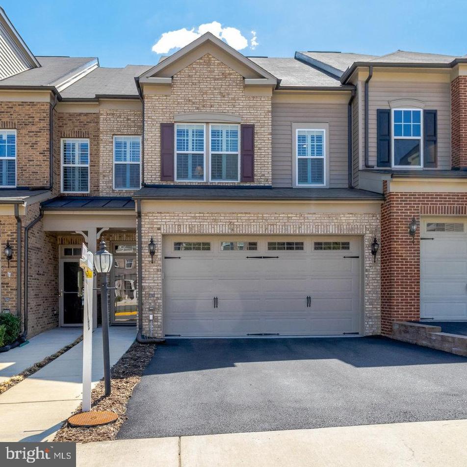 Stunning Luxury Home in Sought-After 55+ Walhaven at Kingstowne Community

Welcome to this immaculate 4-bedroom, 3.5-bathroom luxury home nestled in the coveted 55+ community. Designed for ultimate comfort and convenience, this home is an entertainer's dream, boasting numerous upgrades and a spacious, open layout across three levels. With a private elevator that effortlessly serves all floors, carrying groceries and moving between levels has never been easier.

Gourmet Kitchen & Expansive Living Spaces

The heart of this home is the chef-inspired gourmet kitchen, featuring a massive island with seating, stunning quartz countertops, and top-of-the-line appliances, including a Bosch dishwasher, KitchenAid refrigerator, and a gas cooktop. The large pantry with custom shelving and a dedicated cabinetry area offers ample storage and space for display or entertaining. Open to a spacious great room with built-in cabinets and shelves, the kitchen is perfect for both daily living and hosting family and friends.

The living room and kitchen seamlessly flow into the formal dining area, offering a harmonious setting for gatherings. Through large sliding doors, you'll step into the serene screened-in porch, complete with two ceiling fans and private views—a perfect spot for unwinding or expanding your entertaining space.

Luxurious Primary Suite & Upper Level Retreat

Upstairs, the primary suite is a true retreat, featuring tray ceilings, a massive walk-in closet with custom shelving, and an elegant en suite bathroom. The primary bath offers a dual vanity with a tower cabinet for additional storage, a large linen closet, and a gorgeous walk-in shower with an upgraded glass door. Two additional bedrooms on this level share a full bathroom with a tub/shower combo, and the convenient laundry room includes a utility sink.

Lower Level Entertainment & Guest Suite

The fully finished lower level is a showstopper with 9-foot ceilings and upgraded LVT flooring. A stunning wet bar area, complete with a small refrigerator, ice maker, microwave, dishwasher, and disposal, makes this space ideal for entertaining guests or enjoying family game nights. A spacious family room and game area create endless possibilities for leisure and fun. The fourth bedroom and full bathroom offer privacy and comfort for guests. Plus, there’s a utility room with additional storage.

The lower level walks out to a beautiful stamped concrete patio—perfect for grilling, relaxing, or enjoying the outdoors.

Exceptional Features & Upgrades

This home has over $100K in upgrades!!  It  is also equipped with a Smart home system, controlling door locks, the thermostat, and the sound system for modern living at its best. Wood shutters adorn every window, adding an extra touch of elegance. Recent upgrades include a new heating system (2024), a new A/C unit (2023), a new washer and dryer (2022), and an upgraded automatic inner door for the elevator (2020).

A True Gem in Kingstowne

This luxury home is truly a rare find, combining modern amenities, thoughtful design, and the convenience of a 55+ community in the highly sought-after Kingstowne area. Don’t miss your chance to own this stunning home—schedule a tour today!