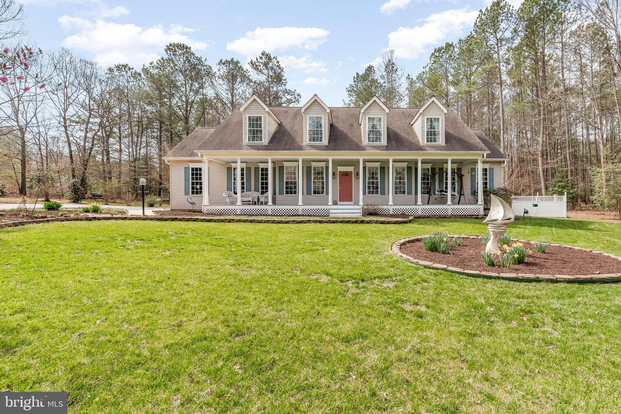 Stunning Cape Cod on 3+ Acres in Leonardtown!

Welcome to this beautifully maintained 4-bedroom, 2.5-bath Colonial offering 2,918 sq ft of spacious living, nestled on 3.13 acres in the heart of Leonardtown. From the moment you arrive, you’ll feel the charm—this home stands out with its impressive curb appeal and serene setting.

The wide, well-manicured driveway leads to a side-load garage, providing ample parking for family and guests. The covered front porch spans nearly the entire length of the home, inviting you to relax with a rocking chair and enjoy peaceful summer evenings.

Inside, you’re greeted by a formal sitting room and dining room, perfect for hosting or relaxing. The sitting room is a cozy space ideal for reading, gathering, or even transforming into a home office. The spacious dining room sets the stage for memorable meals and special occasions.

Continue into the heart of the home—the expansive kitchen featuring stunning granite countertops, abundant cabinetry, a large refrigerator, double oven, and a functional island. It's truly a dream for any home chef! Just off the kitchen is a large, charming breakfast room—perfect for casual meals, morning coffee, or game night with the family. The kitchen also flows seamlessly into a generous living room with a fireplace, perfect for cozy nights in.

Just off the kitchen, the sunroom will quickly become your favorite space in the home—bright, cheerful, and ideal for relaxing or entertaining.

Step outside and you’ll discover an entertainer’s paradise: a large pergola, a flat yard dotted with mature trees, and a charming gazebo that adds even more character to the outdoor space.

Back inside on the main level, you’ll find a standard-size bedroom—perfect for guests—and a spacious primary suite featuring a large walk-in closet and a luxurious ensuite bath with double vanity, separate shower, and a garden soaking tub.

Upstairs offers even more: a versatile attic space ready for storage or future finishing, a fabulous billiard room ideal for game nights, two additional bedrooms (one standard and one oversized), and a full bathroom.

This property is a true gem—one of a kind in a fantastic location with a stunning lot. Don’t wait to make it yours. Schedule your private showing today!