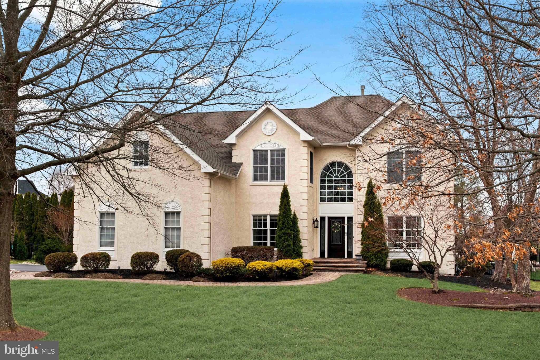 Step up the charming paver walkway and into the impressive two story foyer featuring a graceful turned staircase. To the right, find a formal living room and a bright, inviting office with built-ins and French doors, perfect for working from home. To the left, hardwood floors flow throughout the home, highlighted by crown molding in the living and dining rooms, with classic chair-rail detailing.

The dining room is ideal for entertaining, with hardwood floors, crown molding, and chair rail, leading seamlessly into the gourmet kitchen. The kitchen boasts a center island with gas cooktop, wall oven, breakfast area, pantry, and abundant natural light with serene views of the beautifully landscaped backyard. From here, step into the sunken two-story family room, complete with a striking stone fireplace, perfect for cozy gatherings.

This main level also includes a powder room and a convenient laundry room with direct access to the three-car garage.

Upstairs, the home offers four spacious bedrooms and three full bathrooms. The primary suite features a private sitting area, crown molding, recessed lighting, an enormous walk-in closet, and an en suite bathroom with double doors, dual vanities, a Jacuzzi tub, separate stall shower, and water closet. Two bedrooms are connected via a Jack-and-Jill bathroom with double vanities, while the fourth bedroom serves as a charming princess suite with a tub/shower combination.

The finished basement is designed for entertaining, offering multiple flexible living spaces, a built-in wet bar, and a full bathroom with a shower.

Outside, the backyard is a true retreat for warmer months, featuring a large pool, Jacuzzi, and a built-in gazebo, perfect for entertaining or relaxing in privacy.

This exceptional home combines thoughtful design, impeccable condition, and luxurious amenities in a desirable school districts.