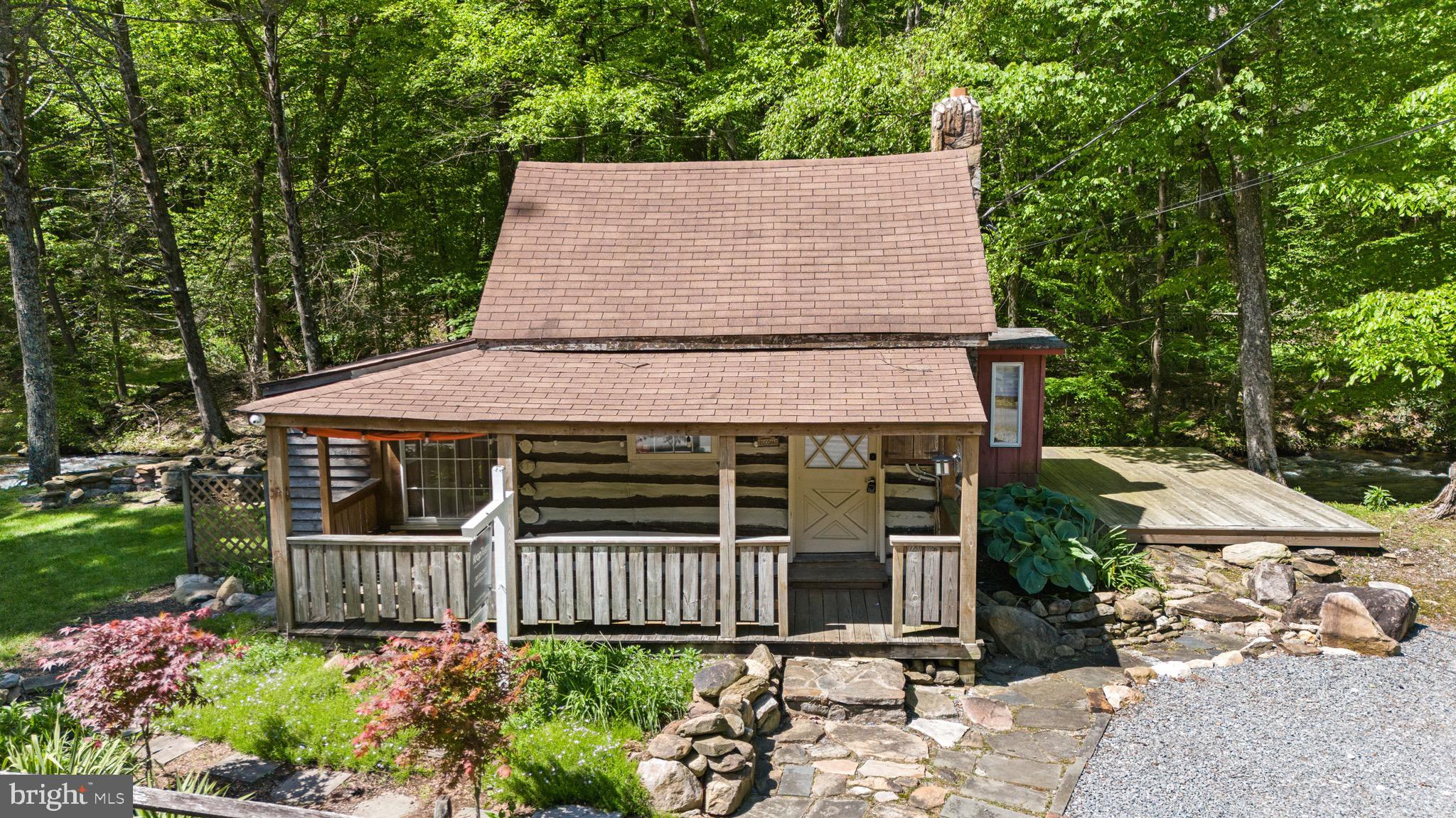 Nestled in a peaceful mountain community near Gambrill Park and the Frederick Watershed, this 744 sq ft log home is a nature lover’s and investor’s dream—offering hiking, biking, and fishing just steps away, with a wide, tranquil creek flowing beyond the back door and untouched woods behind. The home needs significant work, but with its rustic charm, 12x14 barn-style shed, and firepit by the creek, it holds incredible potential as a cozy retreat or weekend getaway. Sold strictly as-is, this is a rare opportunity for the right investor to restore and reimagine a hidden gem. While flood insurance is required for financing, the peaceful setting and beauty of the surroundings make it a worthy investment.