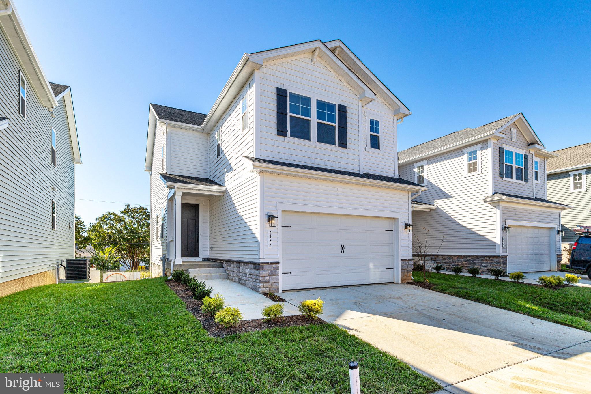 WITH RATES BEING OFFERED UNDER 5% YOU CAN OWN THIS NEW CONSTRUCTION MOVE-IN READY HOME FOR THE SAME P&I PAYMENT AS A $515,000 RESALE!! This brand-new 3-bedroom, 3 1/2 bath Lana by Richmond American Homes. The main floor of this charming Lana plan offers an inviting great room with Mohawk luxury vinyl plank floors on the main level, 9' ceilings with 8' doors, a powder room, gourmet kitchen with a convenient island, quartz countertops, backsplash, pantry with wood shelves.  Upstairs, you’ll find three elegant bedrooms, including an impressive primary suite showcasing a roomy walk-in closet and a deluxe bath with double sinks. A secondary bath, top floor laundry, 2-car garage with EV charging station, video doorbell, smart locks, and a finished basement with 9' ceilings, rough-in for wet bar with a full bathroom complete this home. Enclave at Arundel Hills is an exciting new community in Glen Burnie. It offers easy access to major employers in Baltimore, Annapolis, and Washington D.C. via I-695 and I-97 and is located just minutes from Fort Meade. Residents can also appreciate close proximity to BWI, countless dining options and minutes to waterfront restaurants, and entertainment options. Choose from an attractive array of single-family homes, each boasting the designer details and in-demand features today’s homebuyers are seeking! Model is OPEN but visitors are encouraged to call ahead to be guaranteed a dedicated appointment.