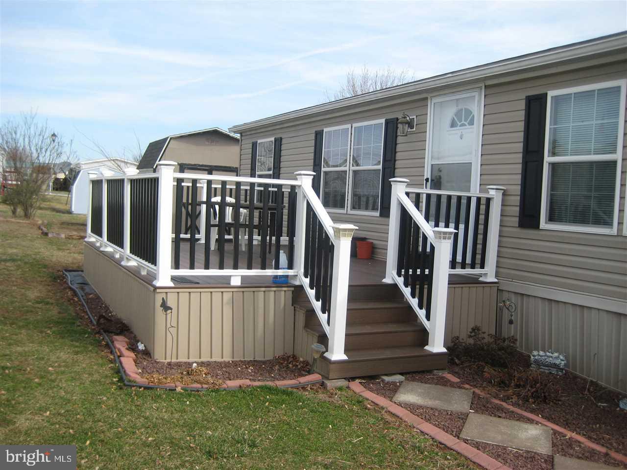 Better than new doublewide home! 3 BR 2 BA with open floor plan. Original owners keep this home spotless! Great 12 x 16 composite deck with vinyl railing!  Master has full bath w/ soaking tub/shower, built in storage cabinets and walk in closet. Nice closet space in other 2 bedrooms and full bath as well. All kitchen appliances stay!  Must see to appreciate!