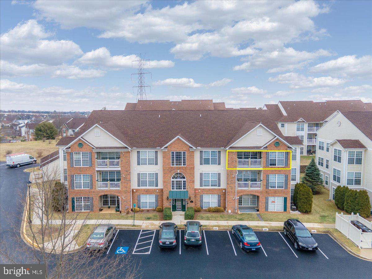 Enjoy the convenience of condominium living in the amenity filled community of Whittier.  This 3rd floor condo has dramatic ceilings and an open space floorplan.  Best of all, it is located in one of the few elevator buildings, so no steps required and this is a secure building. The present owner installed solid hardwood flooring in the entry foyer, living and dining rooms just a few years ago. There are 3 ceiling fans with a washer & dryer in the condo. The kitchen has stainless steel appliances and opens to the living area. Natural gas heat, natural gas water heater and electric central air condition. All curtains remain with the condo.   Enjoy relaxing on your private balcony. Whittier has an exceptional location not far from Historic Downtown Frederick and has easy highway access. The community offers 3 parks, 3 swimming pools, tennis courts, ballfields, playground equipment, sidewalks, walking trails and so much more.