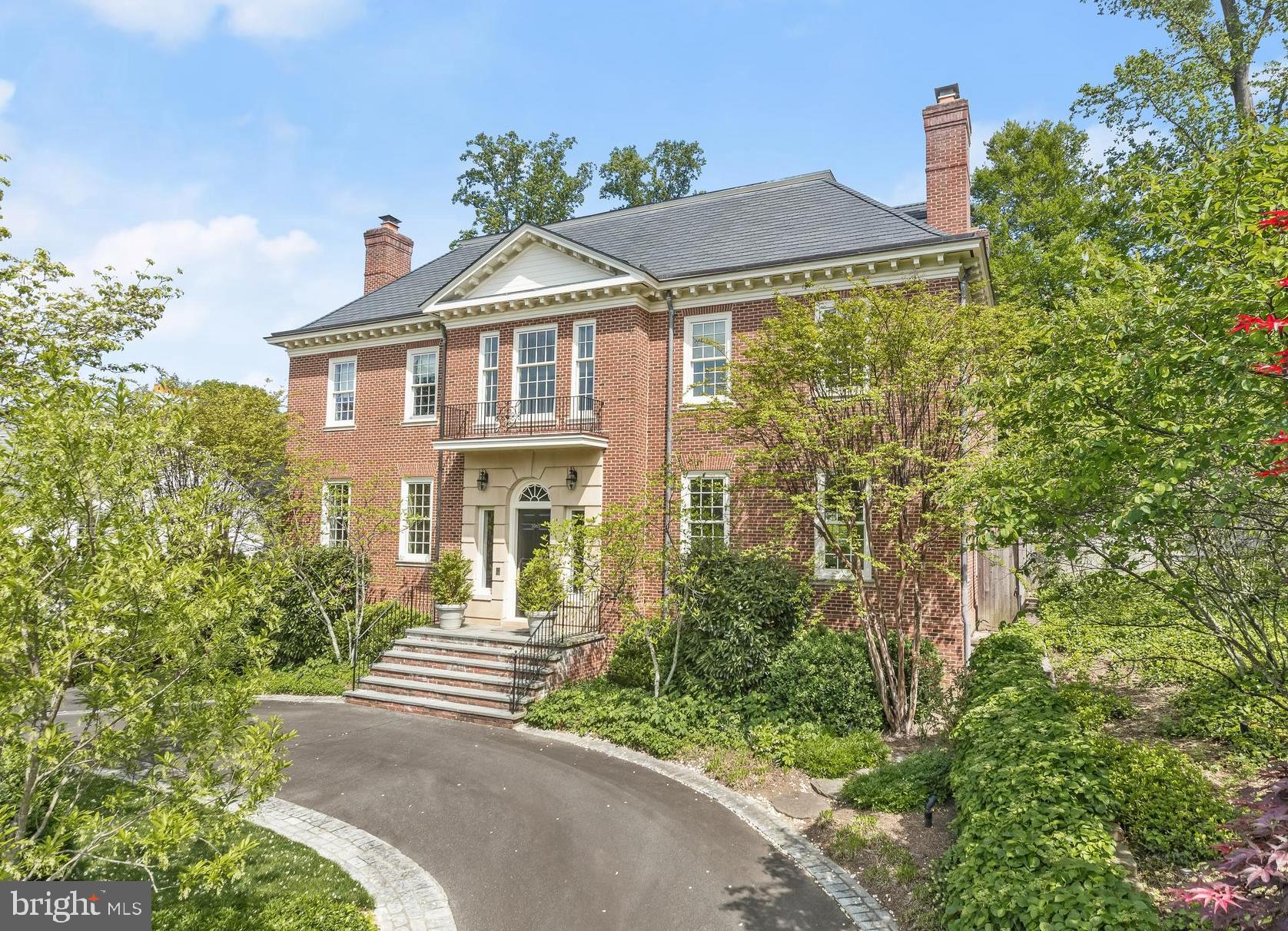 Fantastic New Price in Kent! This elegant custom-built Georgian home, featuring classic architectural elements, is situated on an expansive and meticulously landscaped lot. Constructed by Jim Gibson, the residence spans over 8,200 square feet of interior space, offering spacious, welcoming, and well-lit rooms with exquisite detailing throughout. The versatile floor plan seamlessly combines comfort and sophistication, showcasing a sunlit eat-in kitchen with top-of-the-line appliances, a large center island, marble backsplash, as well as a butler’s pantry. Additionally, there is a grand living room, a generously sized family room, a refined dining room, an opulent primary wing, 5 additional bedroom suites, along with 5 fireplaces throughout and elevator access to all four levels. The fully finished lower level boasts a wine cellar/pantry/storage room, a 6th bedroom, a full laundry room with double washer and dryer, along with a side-loading 3-car garage. This 0.41-acre lot features a beautiful flagstone terrace overlooking the gardens, pool, and detached pool house.
Located in the highly sought-after Kent neighborhood, residents enjoy easy access to Battery Kemble Park and nearby shopping and amenities in Spring Valley and The Palisades. This home is convenient to notable cultural landmarks across the Capital region and major commuter routes, making Kent an ideal location.