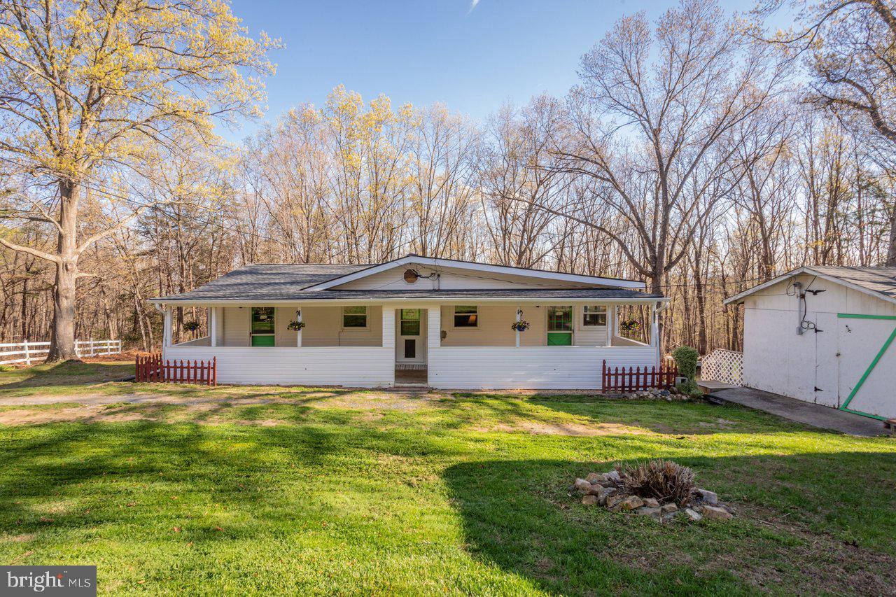 Tucked away in the heart of the Shenandoah Valley, this cozy and beautifully updated 2-bedroom, 2-bath rustic retreat in Stanley, Virginia offers the perfect blend of charm, comfort, and versatility. Set on an impressive 3.82 acres across five parcels, this property provides both privacy and opportunity—whether you're looking for a full-time residence, weekend escape, or investment property.
Step inside to an inviting open floorplan highlighted by stunning knotty pine tongue-and-groove walls and soaring vaulted ceilings, creating that warm, cabin feel everyone loves. The spacious living room is anchored by a cozy propane fireplace—perfect for relaxing after a day of exploring nearby trails and attractions. Both bedrooms serve as primary suites, each featuring its own exterior door leading to the front porch—ideal for guests or added privacy. Recent upgrades completed in 2022, including a new roof, A/C mini splits, windows, and deck, ensure peace of mind and modern efficiency while maintaining the home's rustic character. Outside, you'll find a large, fully fenced area—perfect for pets, gardening, or simply enjoying the peaceful surroundings. In addition, the property features a garage-sized shop that offers incredible flexibility—currently set up as the perfect workshop and storage space, with the potential to be easily converted into a traditional garage with the simple addition of doors. With ample acreage and multiple parcels, the possibilities here are endless. Conveniently located just minutes from the charm of Stanley and the popular attractions, dining, and outdoor recreation of Luray, this property truly offers the best of Shenandoah Valley living. Don’t miss your chance to own this mountain retreat with space, style, and income potential!