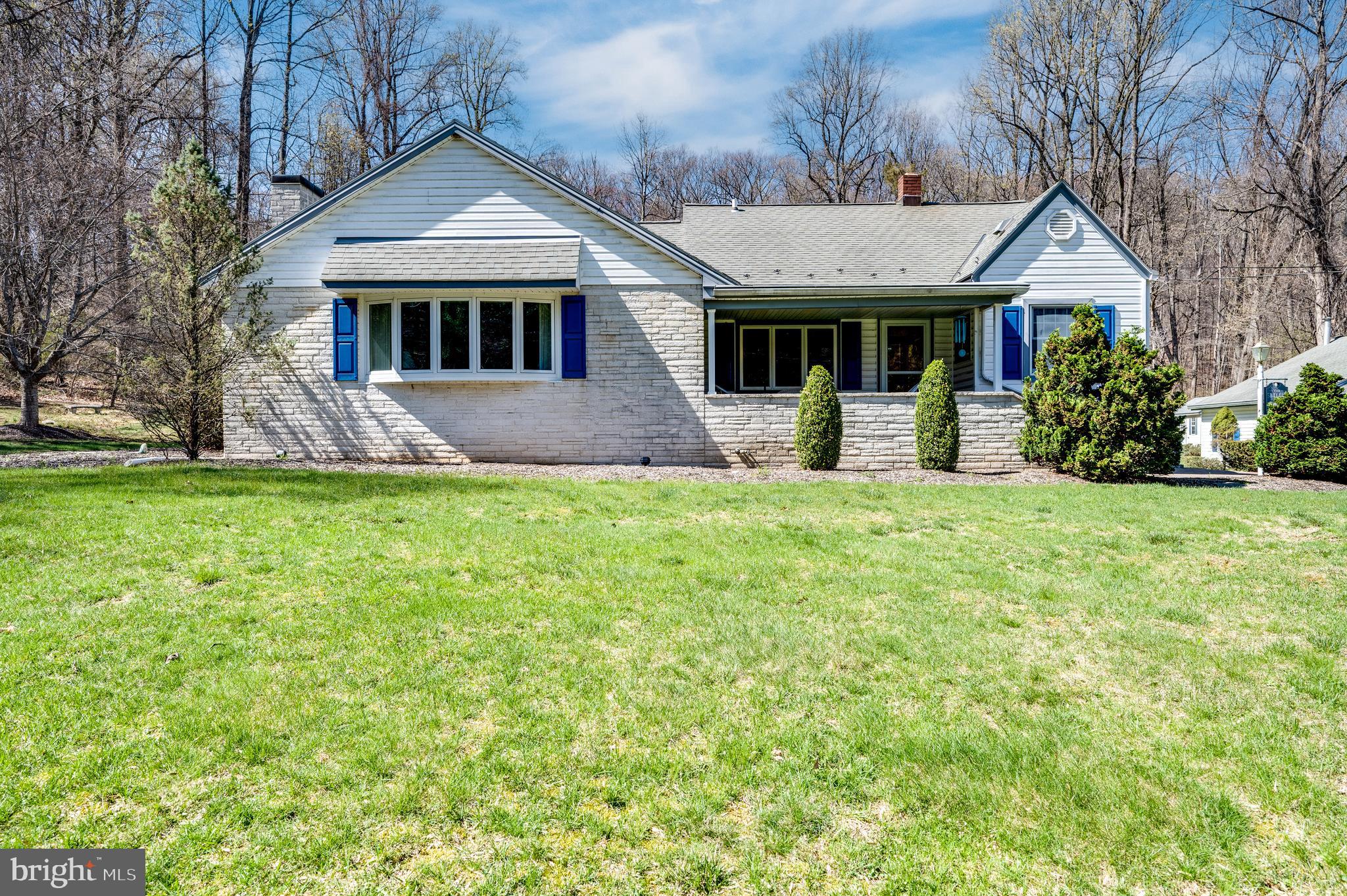 Set amid the peaceful countryside on over 2 acres of beautifully manicured land, this charming Cape Cod-style home offers the perfect blend of comfort, character, and space.  Step inside to discover a custom-designed kitchen featuring Corian countertops, a glass cooktop, and double ovens — ideal for anyone who loves to cook and entertain. A spacious family room with a cozy brick fireplace invites you to relax and unwind.  The primary bedroom provides a tranquil retreat, while two additional bedrooms offer flexibility — including one tucked away upstairs for added privacy. The main floor also includes a laundry room that could easily be converted back into a fourth bedroom if desired.  A true highlight of this home is the stunning sunroom — a massive space perfect for hosting holidays, family gatherings, or simply enjoying the scenic surroundings year-round. With exposed wood beams, an abundance of windows, beautiful tile flooring, and a convenient wet bar, the sunroom is a space you'll never want to leave.  Outdoors, the property continues to impress with a 3-car detached garage, a storage shed, and an additional oversized shed that can accommodate two more vehicles. Summertime will feel like a dream with the in-ground pool, fully fenced with vinyl fencing and accented by a picturesque gazebo.  Lovingly maintained and cared for by its longtime owner, this home offers a rare opportunity to own a slice of country paradise — with all the amenities to enjoy it to the fullest.