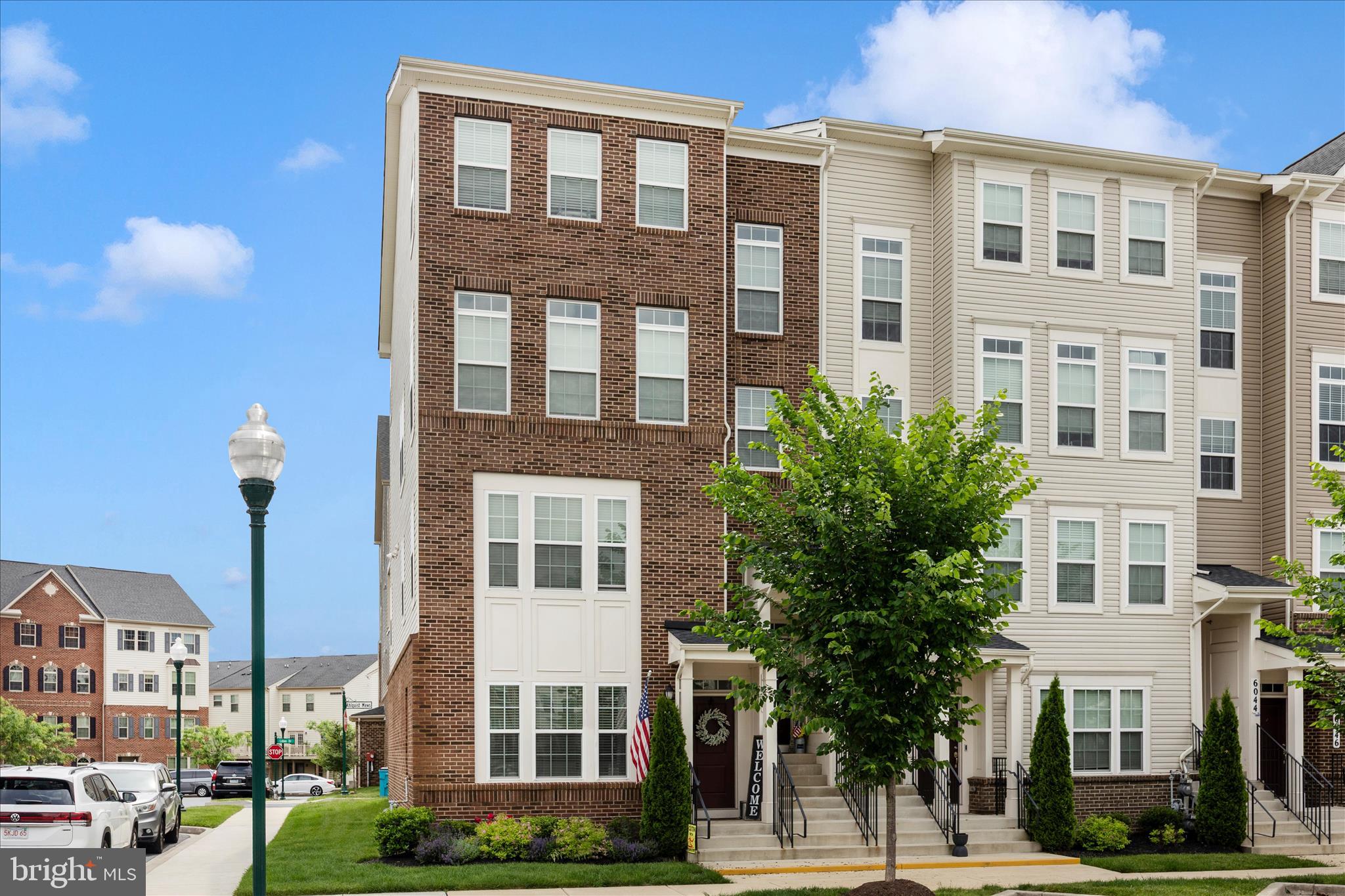 Welcome home to this beautifully maintained end-unit condo in the sought-after Jefferson Place community! This upgraded end-unit offers extra windows for abundant natural light, a prime location overlooking the tot lot and recreation area, and convenient ground-level entry with no extra stairs to climb.

The open-concept main level features luxury plank flooring, 9-foot ceilings with crown molding, upgraded bronze fixtures, and a functional layout perfect for everyday living. The kitchen includes stainless steel appliances, pendant lighting, a large center island with breakfast bar seating, garage access, and a convenient half bath.

Upstairs, you’ll find three spacious bedrooms, including a primary suite with a private bath, two walk-in closets with custom built-ins, and extra storage space. One secondary bedroom features access to a private balcony, while the third enjoys plenty of natural light. A full-sized washer and dryer are also located on the bedroom level for added convenience.

Jefferson Place offers incredible amenities including a pool, clubhouse, 24/7 gym, basketball court, tennis court, dog park, and more, making this community the perfect place to call home.