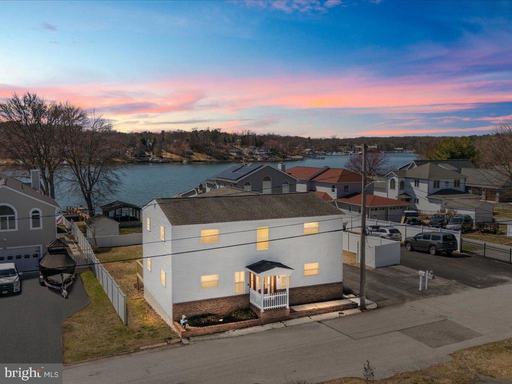 Welcome to your dream home at 408 Carvel Beach Road! This incredible four-bedroom, 2.5-bath residence boasts breathtaking views of Nabbs Creek, making every day feel like a vacation. With a separate one-bedroom in-law apartment complete with its own entrance, this property is perfect for guests, multi-generational living, or creating your ideal home office.

Step inside to discover a freshly painted interior with brand-new carpeting that exudes warmth and modern charm. The impressive tall ceilings in the living room and kitchen create an open and inviting atmosphere, while the convenient half bath adds to the functionality of the main floor.

Venture upstairs to find a spacious layout featuring four bedrooms, including a luxurious primary suite with its own full bathroom. The well-placed laundry room on this floor adds an extra layer of convenience to your daily routine.

The in-law suite is a fantastic bonus, offering a cozy bedroom, a fully equipped kitchen, separate laundry, and a full bathroom, ensuring privacy and comfort for anyone who stays there.

Don’t miss out on this unique opportunity! Schedule your showing today and start envisioning your life in this beautiful home.