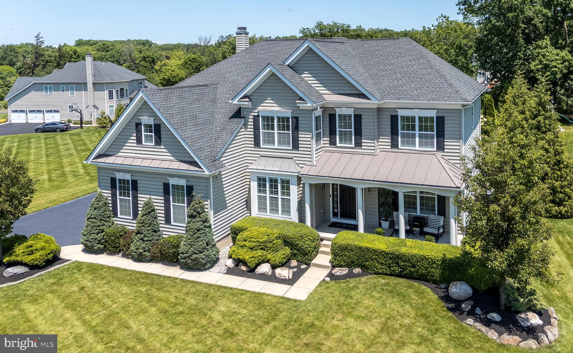Open House is CANCELLED - home is under contract.  Tucked away in the heart of Bucks County, this sophisticated, designer-curated home is a true masterpiece of luxury living. Every inch has been meticulously crafted with high-end finishes and thoughtful design. This one-of-a-kind home is the epitome of luxury, boasting designer finishes and architectural details that blend elegance with functionality. At the center of it all is the gourmet kitchen, complete with a 10-foot quartz island perfect for cooking and socializing with a walk-in pantry, under-cabinet lighting, and high-end stainless-steel appliances.  A spacious breakfast area with a skylight and sliding door that opens to your private outdoor retreat. The adjacent dining room features custom wood beams that define the open-concept flow into the living room.  A main floor office with glass doors, a two-story family room featuring a stacked stone gas fireplace with custom shelving, and Brazilian hand-scraped hardwood flooring that tie together the main living spaces with style and class. Two custom staircases—both front and back—are highlighted by modern black wrought iron railings, leading you to a breathtaking primary suite with a large bedroom and sitting area, and a carefully crafted walk-in closet with fingerprint lock. The ensuite bath is a showstopper, fully renovated with rich English walnut wood and luxury finishes throughout. Three additional bedrooms offer built-in closet systems and generous dimensions, with bedroom 2 enjoying its own private full bath. Bedrooms 3 and 4 share a Jack & Jill bath—perfect for a growing household or guests. The professionally finished basement adds another level of luxury with LVP flooring, a 5th bedroom, a kitchen, a full bath, English walnut shelving, and a pool table included—ideal for entertaining or multi-generational living. Step outside into your own private resort: a manicured yard, large pool with lighting, hot tub, stamped concrete patio with a natural gas fireplace, and a covered lounge area with TV. It’s a true backyard paradise built for making memories.  This home is equipped with an advanced smart system that allows you to control the pool, spa, outdoor lighting, and irrigation—all from the convenience of a mobile app. Enjoy effortless luxury living with just a tap on your phone. Additional highlights include a spacious 3-car garage with mezzanine storage, plantation shutters and recessed lighting throughout, a built-in speaker system on the main floor and outdoor areas, and a two-zone HVAC system with two brand-new A/C units. For added comfort and convenience, the home also features new pool equipment, a water softener with reverse osmosis system, and a central vacuum system—every detail thoughtfully designed for luxury living and effortless maintenance. This home is more than move-in ready—it’s magazine-worthy. Schedule your private tour today and experience custom luxury like never before.