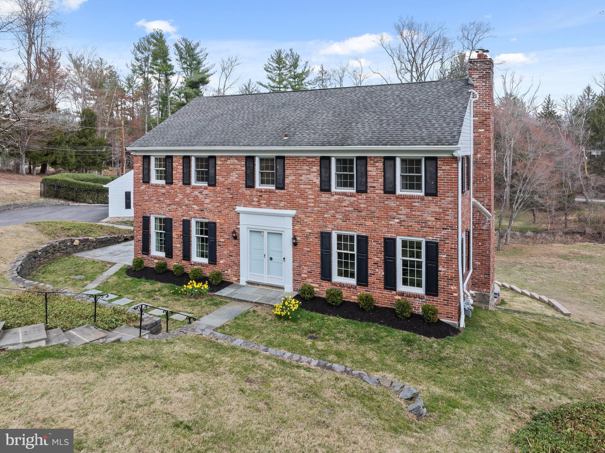 Welcome to 117 Adrienne Lane!  Ideally located on a quiet cul-de-sac in northside Wynnewood, this pristine Classic Brick colonial home will be your private oasis!  This beautiful 4 bedroom, 3 full/2 half bathroom quintessential Main Line home is situated on over one and a half acres of sprawling landscaped grounds on a private lane in Lower Merion Township.  The plush greenery is highlighted with a flagstone terrace, and a large composite deck overlooking the gated glistening pool perfect for summer!  The grounds are truly magical!   As you enter the home through a double door front entrance to a center hall foyer, prepare to fall in love with this GEM!  To the right, is an extra large formal living room complete with a gas fireplace, and extra large windows that drench this room with natural light.  Adjacent to the living room, is an elegant formal dining room.  The heart of the home is the updated kitchen with warm cherry cabinets, granite countertops and stainless steel appliances which opens directly into the breakfast room AND a large fireside family room addition with soaring vaulted ceilings, and an abundance of natural light from the large windows!  The views from these windows overlooking the pool and the grounds are just spectacular!  On the main level, there is also a bonus living area and a powder room!  The second floor has a wonderful layout with four spacious bedrooms, including a primary suite with an updated en-suite bathroom with a shower.  And there is another bedroom with an en suite bathroom, and two additional bedrooms served by a hall bathroom. The current owners conveniently added a washer and dryer on the second floor.  The walkout lower level is super clean with epoxy floors, and includes an additional powder room, storage areas, additional laundry area (perfect for pool towels!) and a meticulous utility room featuring a newer tankless hot water heater and systems.  The two car detached garage is also in mint condition, which also boasts epoxy floors.  Gleaming hardwood floors run throughout the home.  The interior of the home was just freshly painted, as well as many other notable improvements by the current owners including Elfa custom closets in two of the bedrooms. Please see the full list of improvements that is provided with listing documents. This home has been impeccably maintained by it's current owners with the intent that this would be their forever home, and they are only moving due to relocation.  117 Adrienne Lane is located in an ultra convenient location and situated in the award winning Lower Merion School District (Penn Valley Elementary, Welsh Valley Middle and Lower Merion or Harriton high school CHOICE zone.). Extremely central to the train and all major roadways making it a commuter's dream.  Super close to shops, restaurants, Suburban Square, Whole Foods, Trader Joe's, Clubs, Parks, literally everything!  This home comes with a whole house generator, and is completely "move in" ready!  Style and beauty at every turn, make your appointment today!