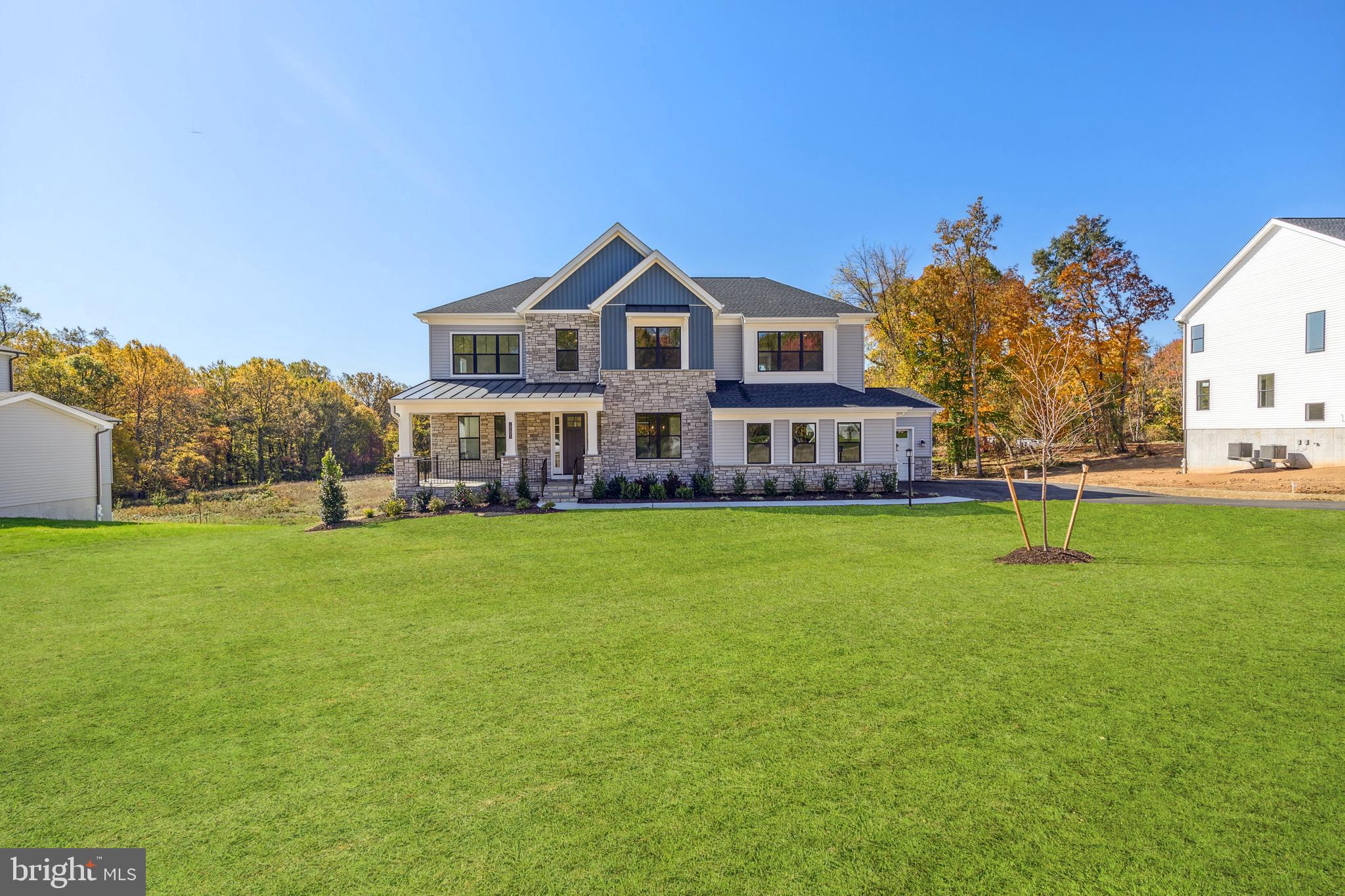 Immediate Move in! SFH, 4 bedrooms, 3 full baths & two half baths, 6,063 sq. ft., W/oversized 3 car-garage. Nearly an acre homesite, buffering to open space/conservation area on front and back great for privacy. Top rated schools, that are highly sought after, part of the coveted Centennial School District. Designer appointed features throughout, including stacking doors that open onto a large covered luxury outdoor living deck, W/fireplace and screen- great for entertaining. This open floor plan has an amazing chefs kitchen W/industrial grade Jenn Air SS appliances & large island, walk in pantry for all your cooking needs. Plus a cozy great room with fireplace,  two large dining areas, a bright study and bonus loft, will make this your forever home. There are oak stairs leading to the second floor primary bedroom that has a large walk- in closet and spa bathroom with shower and freestanding Kohler tub. Walkout basement has been finished to include a rec-room, half bath & wet bar rough-in. Extra windows were added to bring in even more light (Hardwood & tile throughout NO carpet!). Convenient to commuter routes in the heart of Ellicott City, minutes away from restaurants & shopping. Don’t miss out schedule an appointment today!