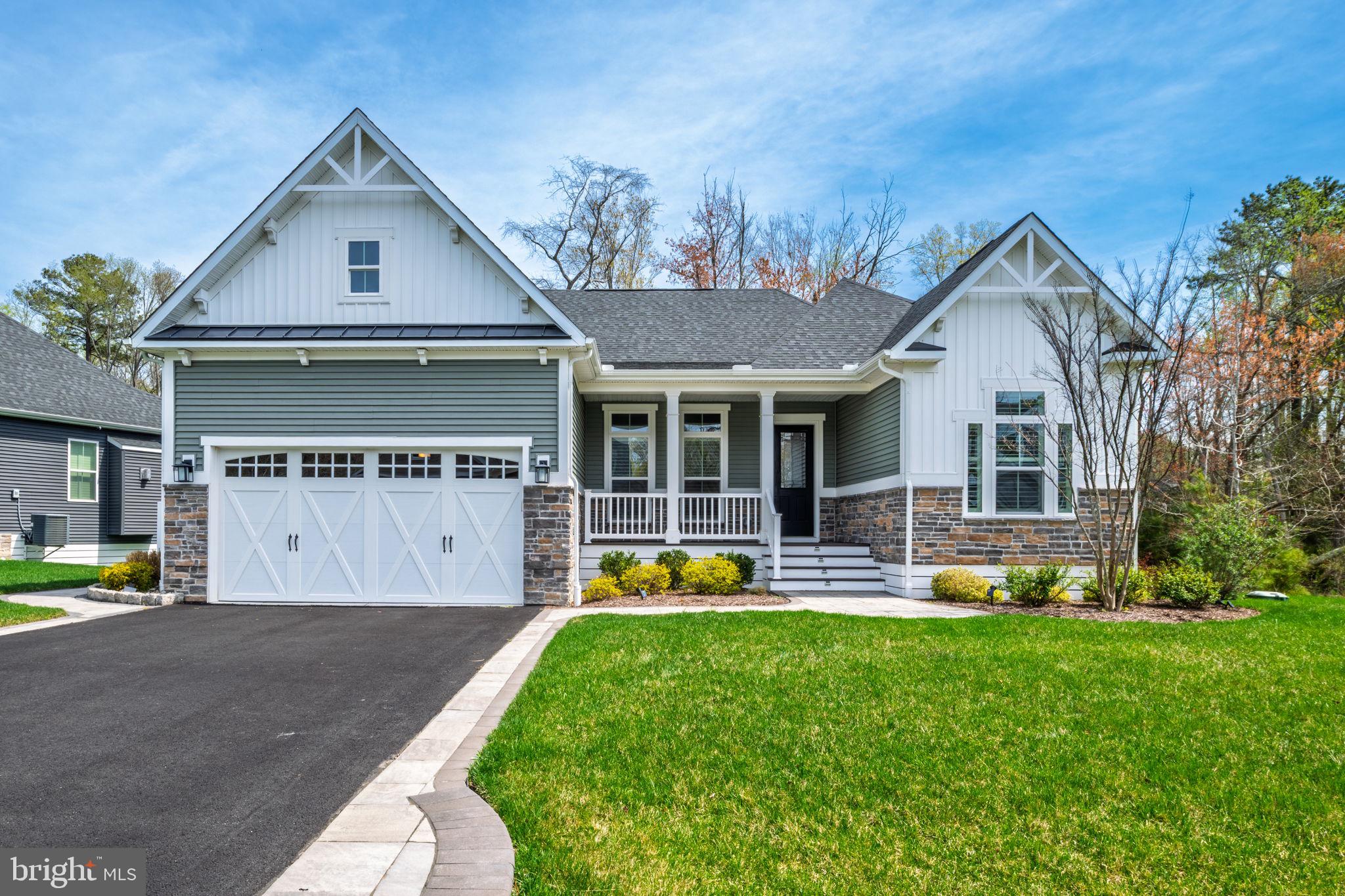 Discover easy coastal living in the Woods at Arnell Creek. Tucked inside a quiet 32‑home neighborhood, this 2020 home delivers privacy, style, and convenience—just minutes from the best of the area. The open floor plan features 10ft ceilings, hardwood floors, plantation shutters, crown molding, recessed lighting, tray ceilings, and custom window shades.
The gourmet kitchen is the heart of the home with upgraded counters, designer backsplash, stainless steel appliances, a large island, and table space overlooking the bright family room with a gas fireplace. The dining room—currently used as an office—adds versatility and charm.
The primary suite is spacious and serene, offering a walk‑in shower with seating, dual sinks, and modern lighted mirrors. The second full bath mirrors the same clean, modern finishes.
Outdoor spaces shine: a welcoming front porch, screened back porch, patio, landscape lighting, irrigation, and peaceful wooded/marsh views. Premium lot with excellent curb appeal. A truly move‑in ready home in a sought‑after community.
